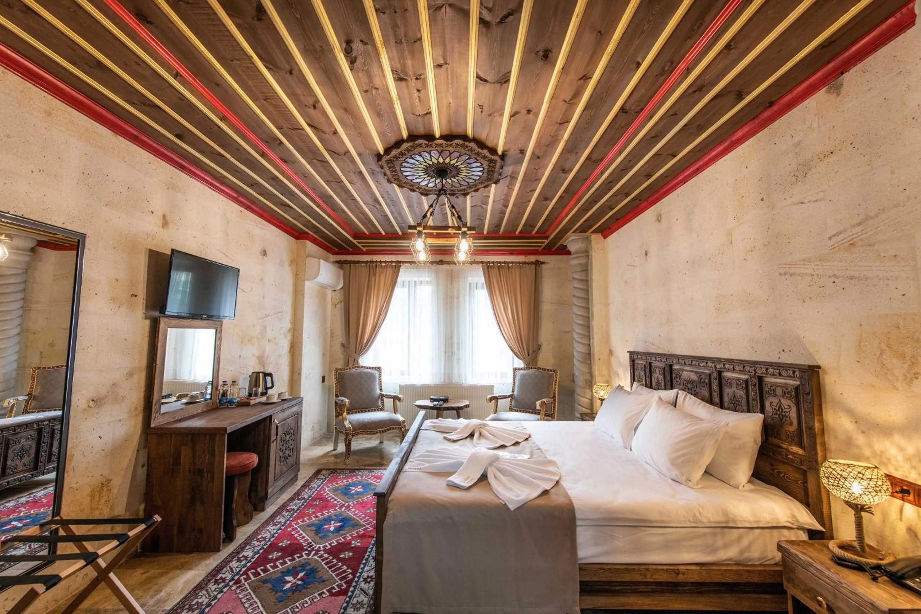 Bed in Volare Stone Hotel