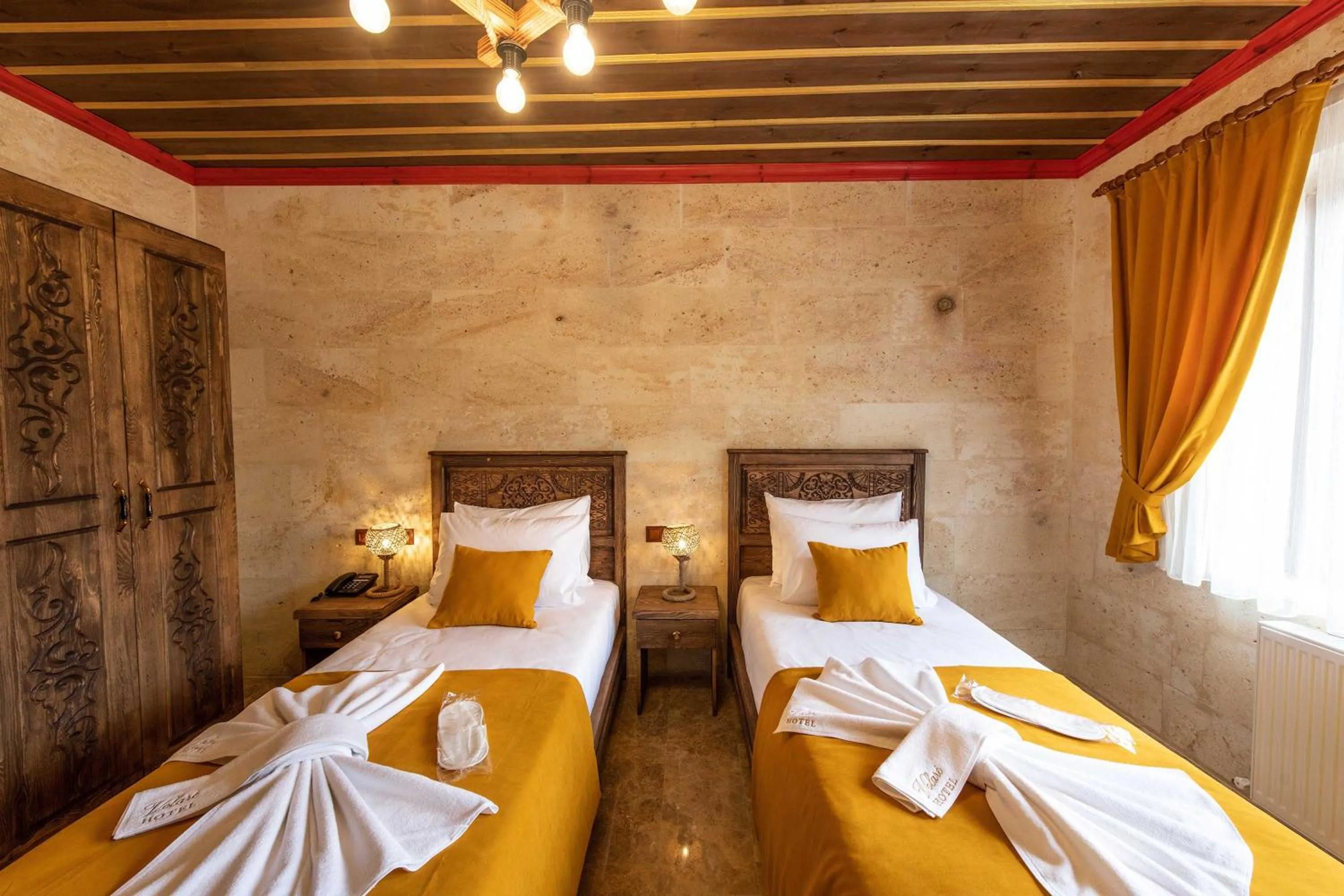 Bed in Volare Stone Hotel