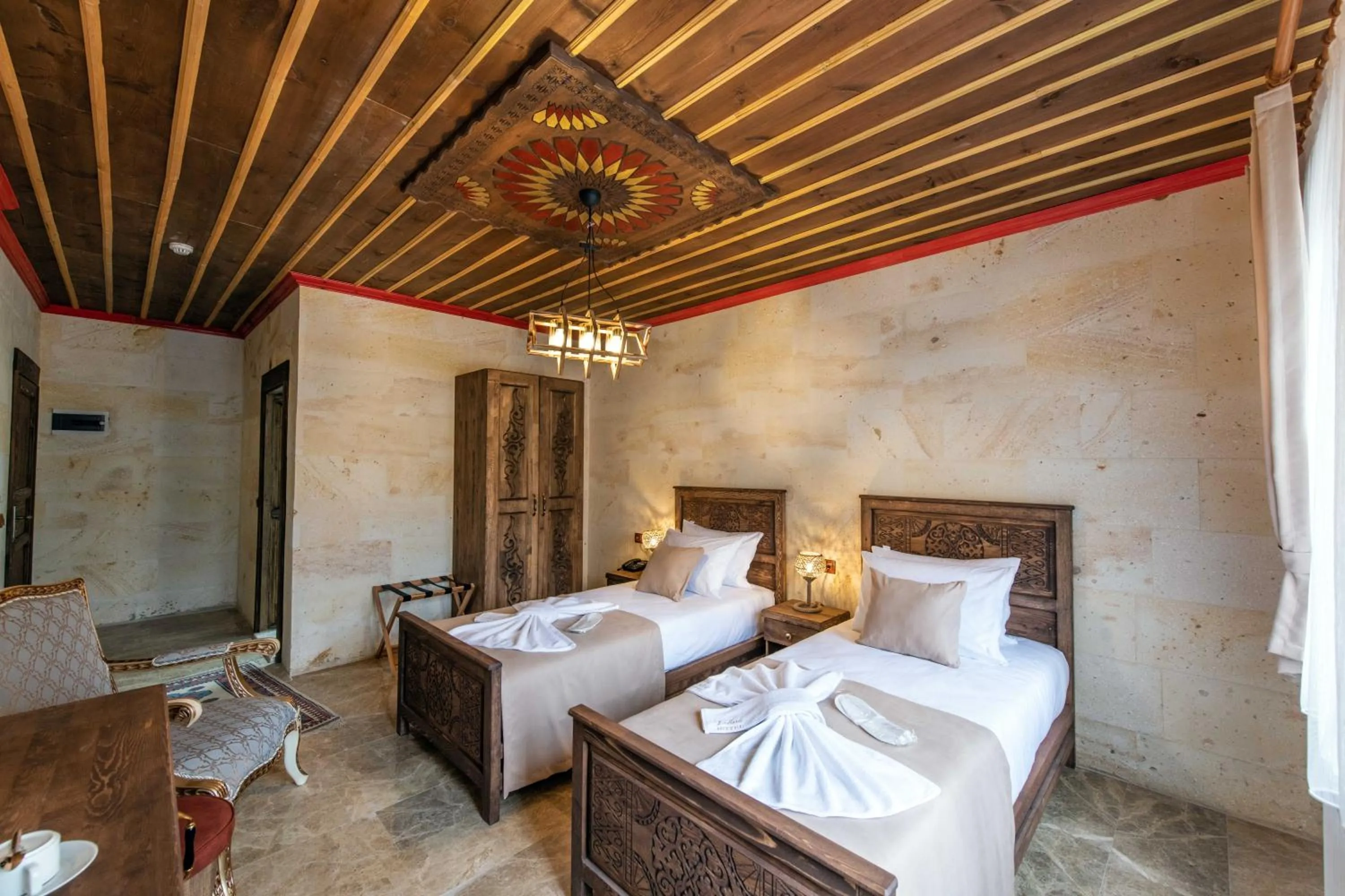 Bed in Volare Stone Hotel