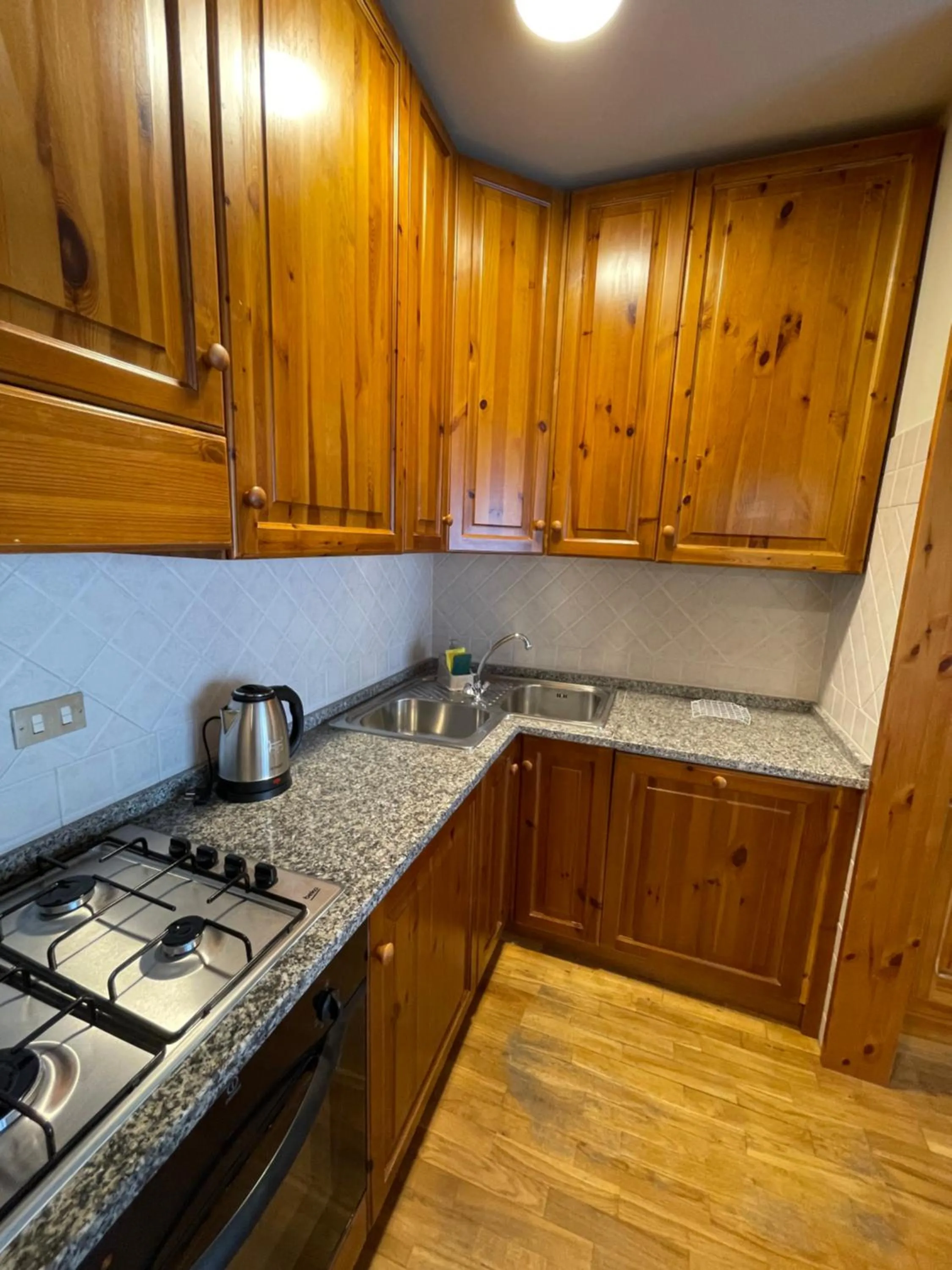 Kitchen or kitchenette in Residenza Riva Wellness Apartment Spa