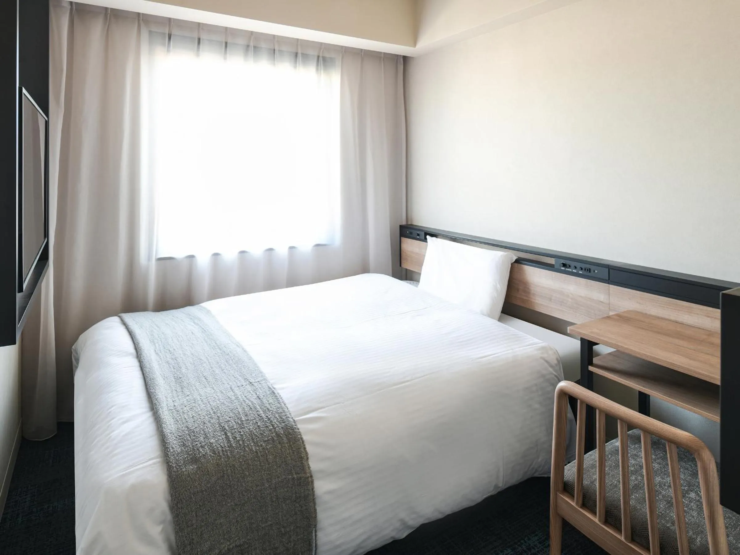 Bed in REF Kansai Airport by VESSEL HOTELS