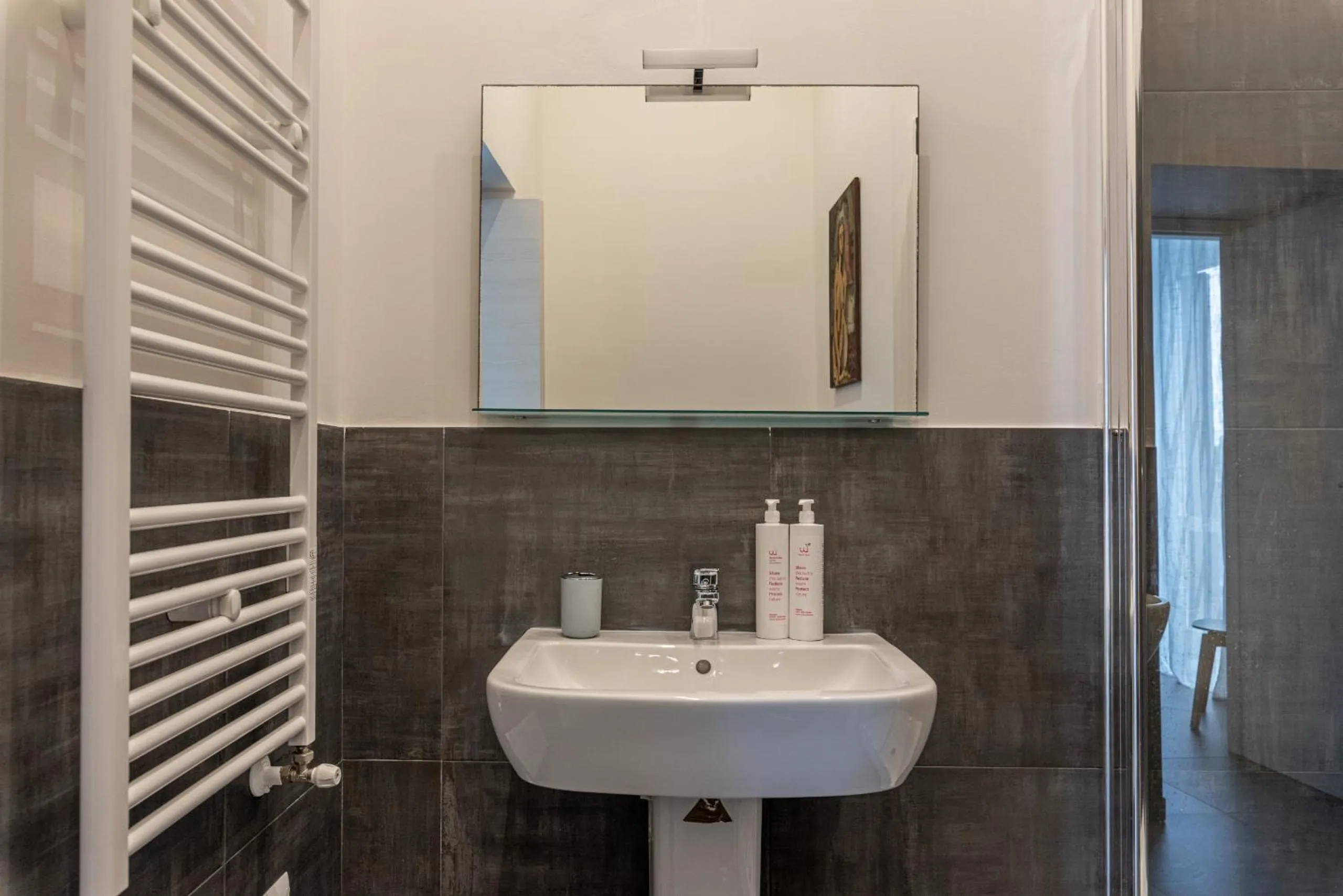Bathroom in Apartments La Cala by Wonderful Italy