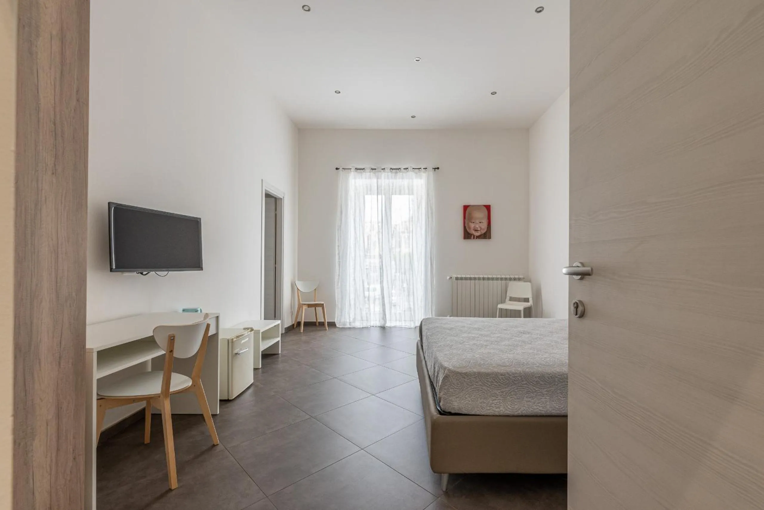 Bed in Apartments La Cala by Wonderful Italy