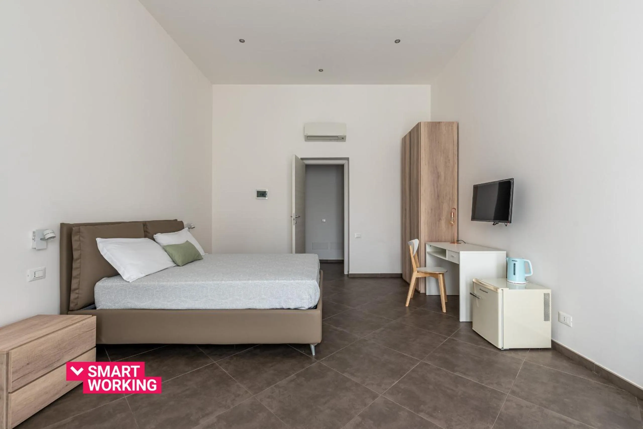 Bed in Apartments La Cala by Wonderful Italy