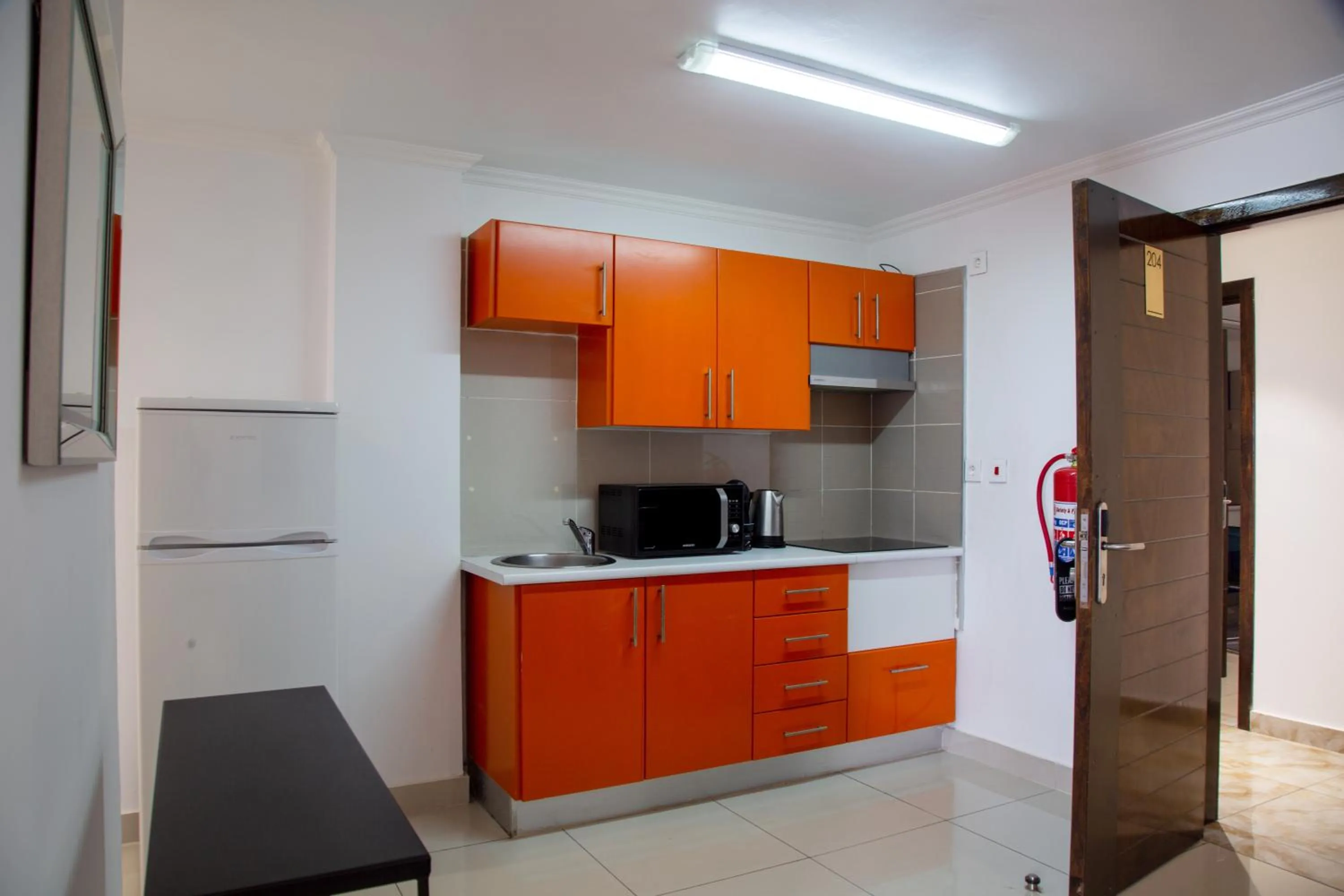Kitchen or kitchenette in WDC APARTHOTEL - BUEA