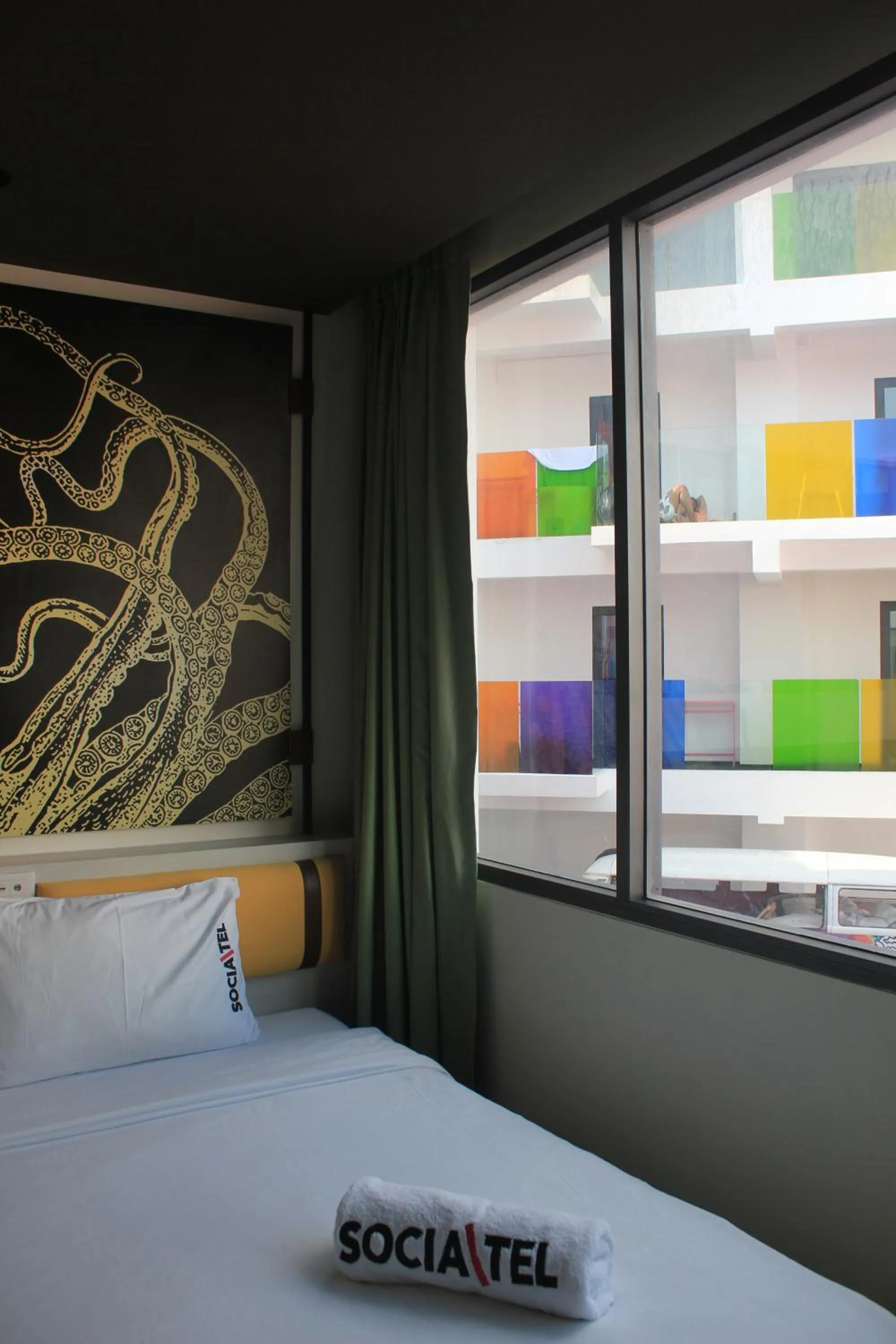 Photo of the whole room, Bed in SocialTel Koh Samui