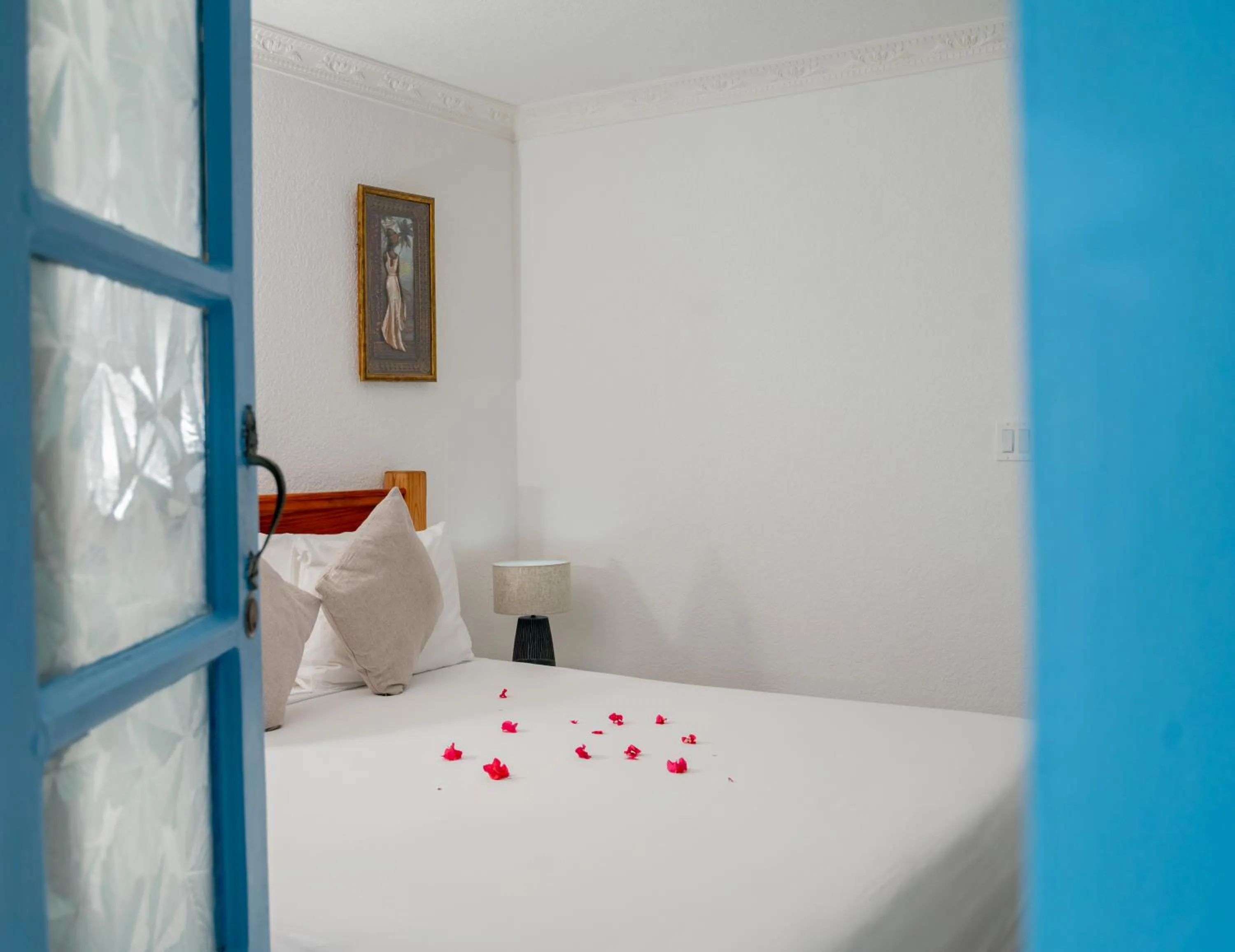 Bed in Beyond Sunset Resort & Villas