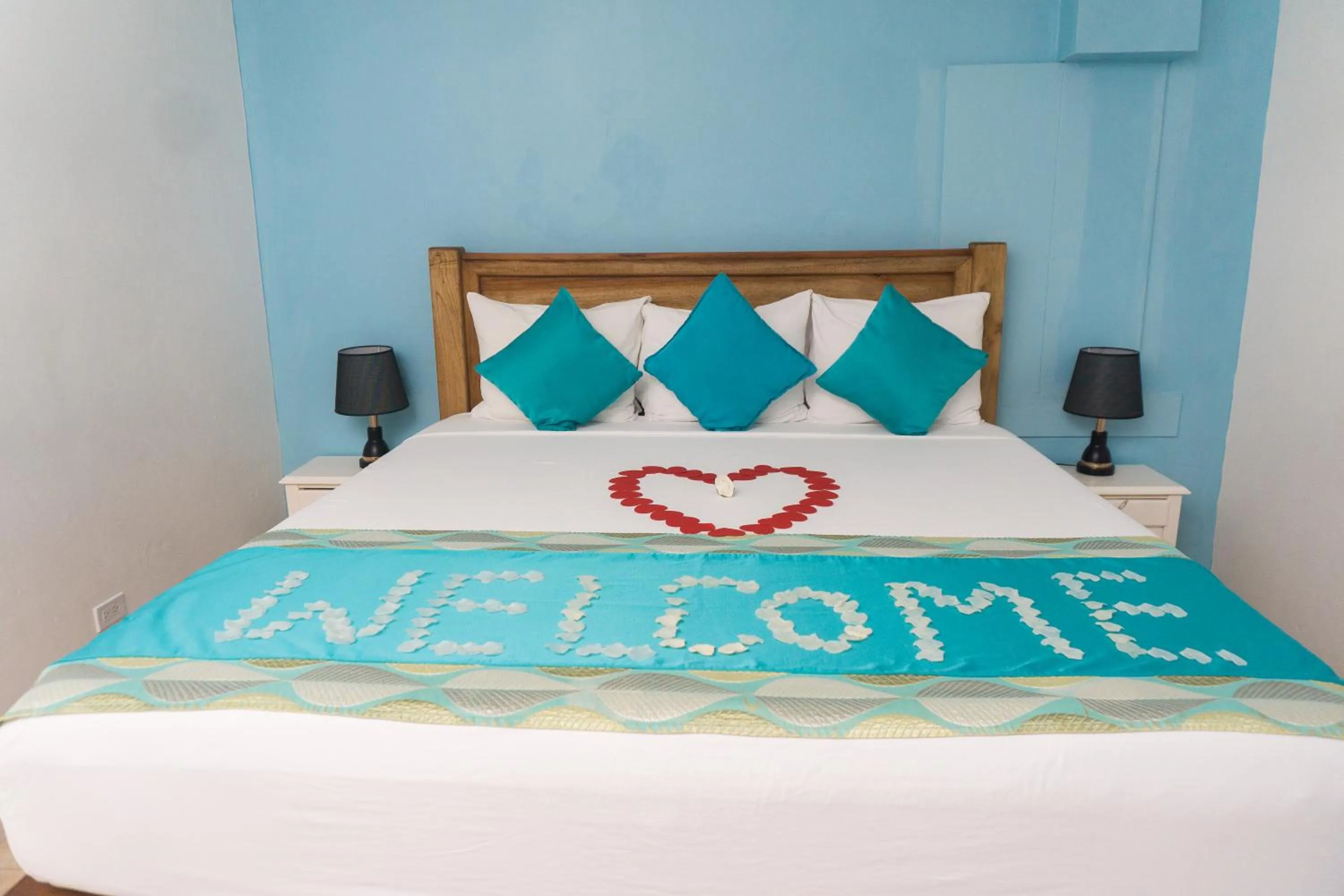 Bed in Beyond Sunset Resort & Villas