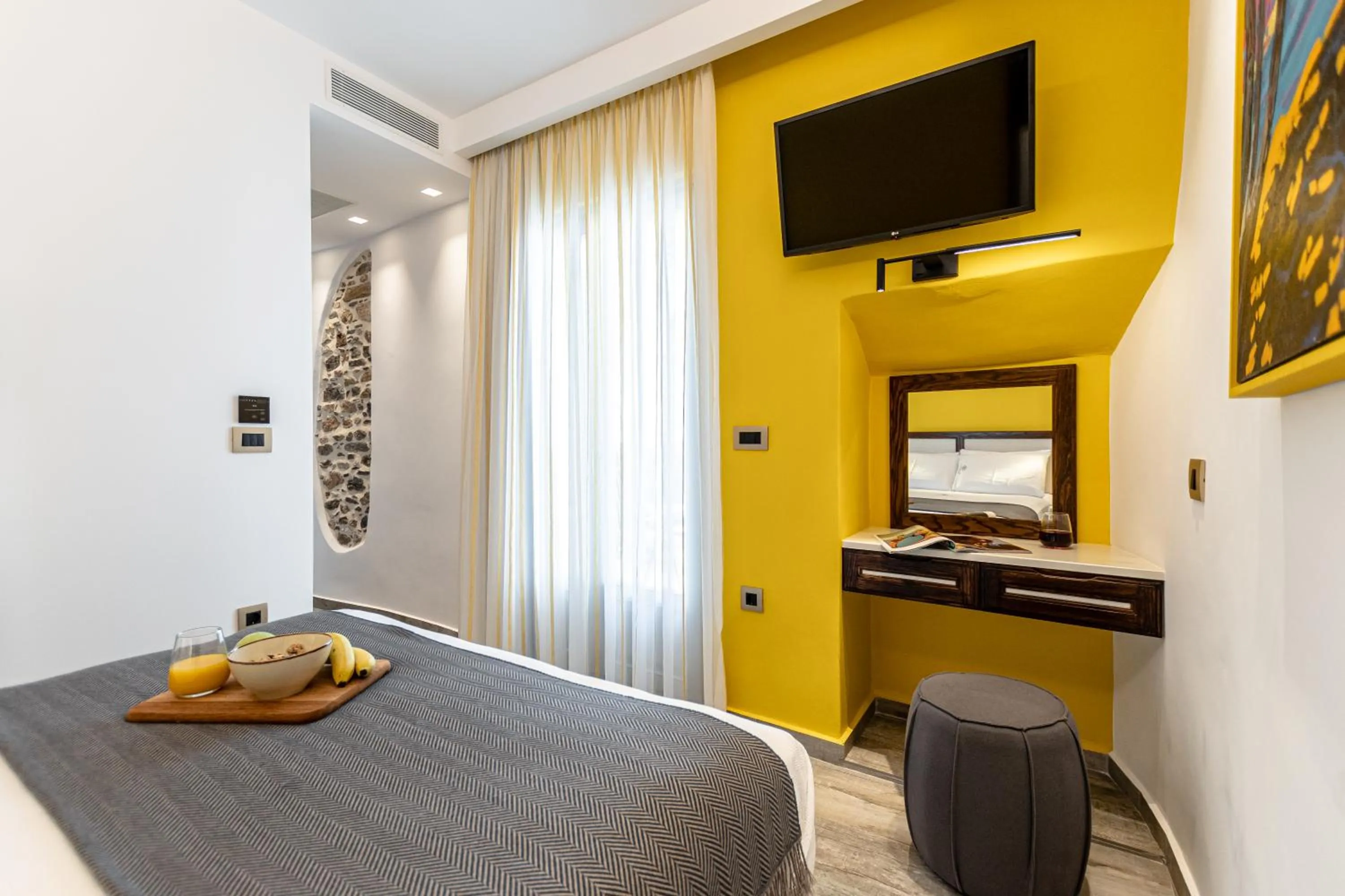 Bed in Mariet Naxos Elegant Suites