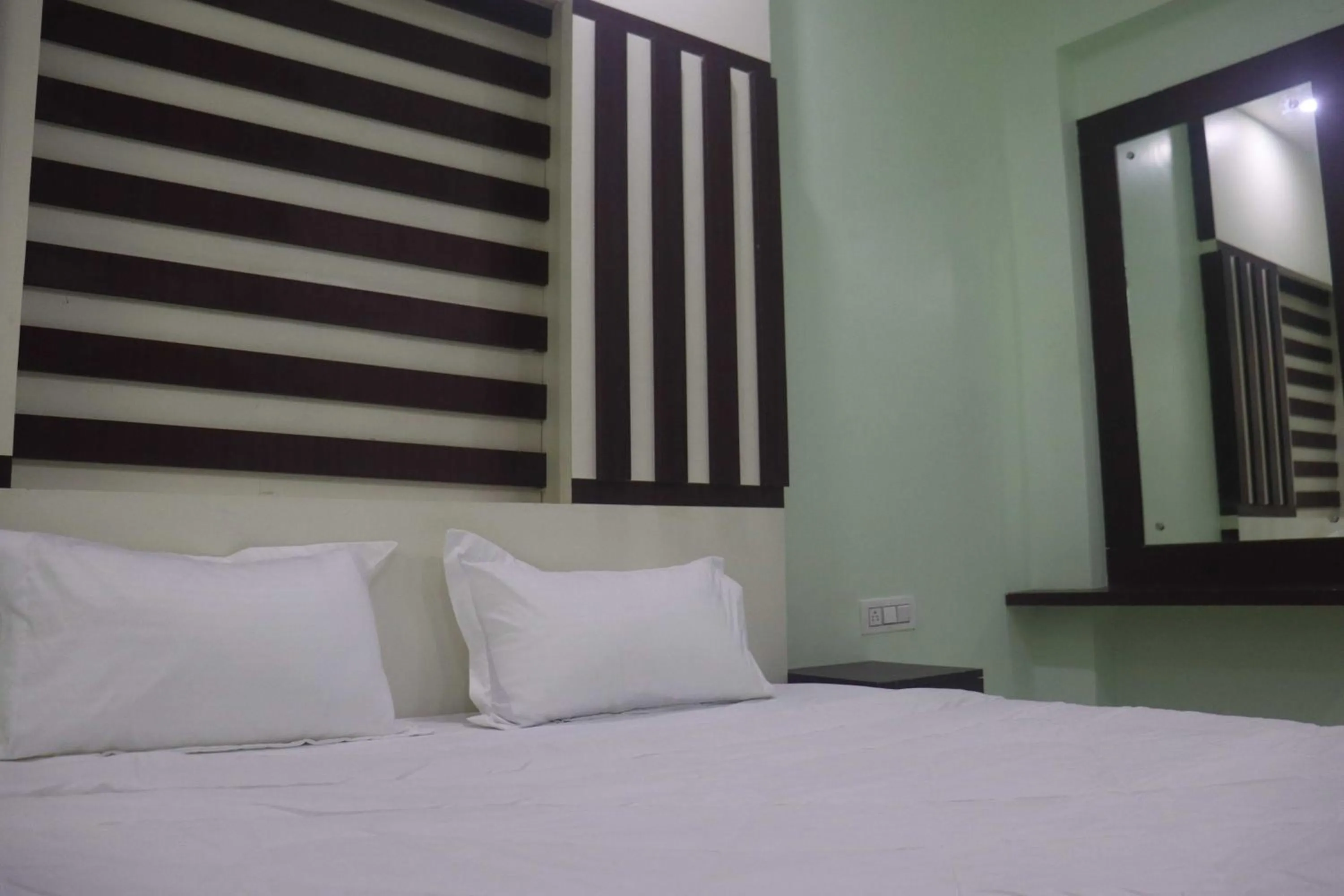 Bedroom in Hotel O Anandam Residency