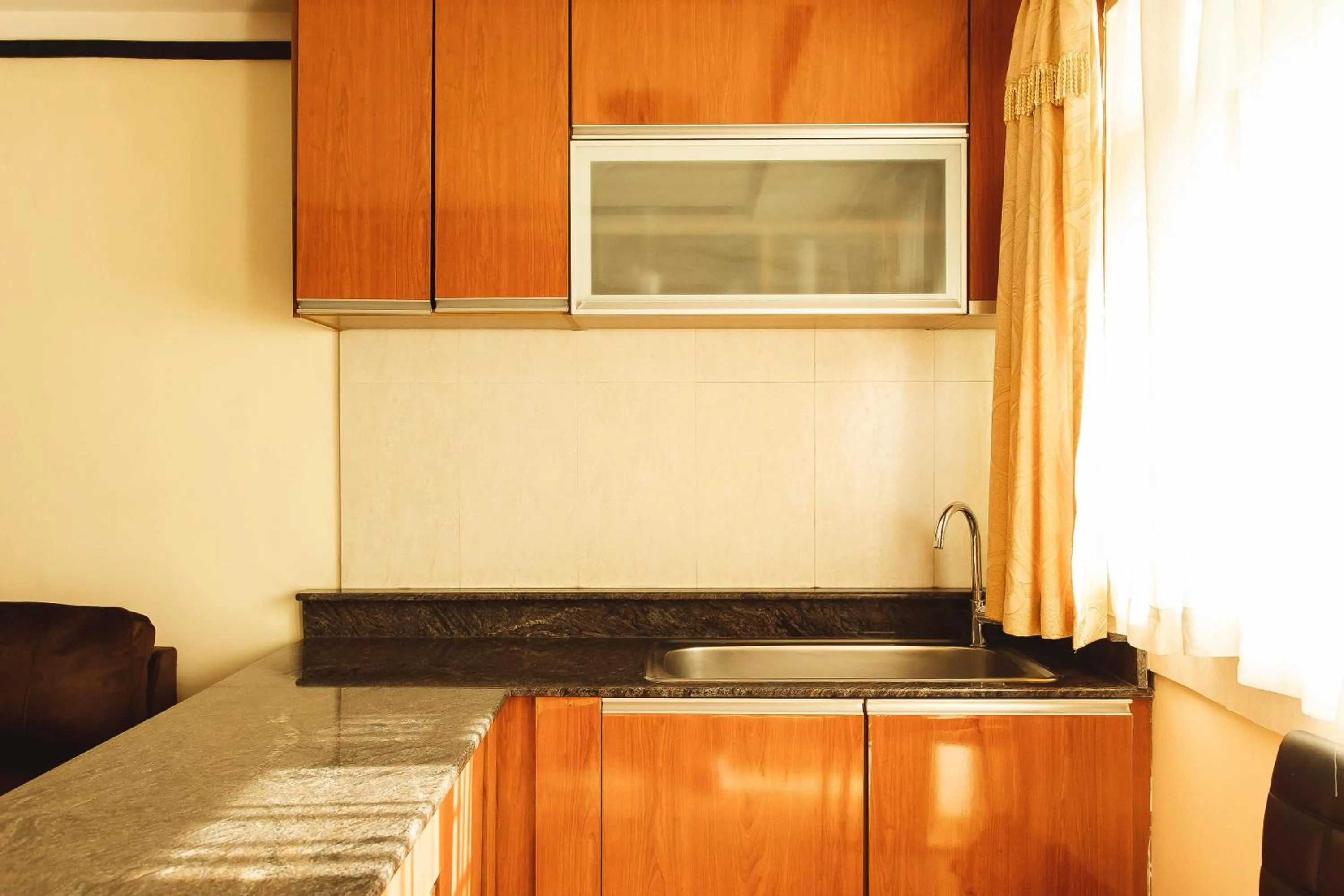 Kitchen or kitchenette in Highlands Suites Hotel and Apartments