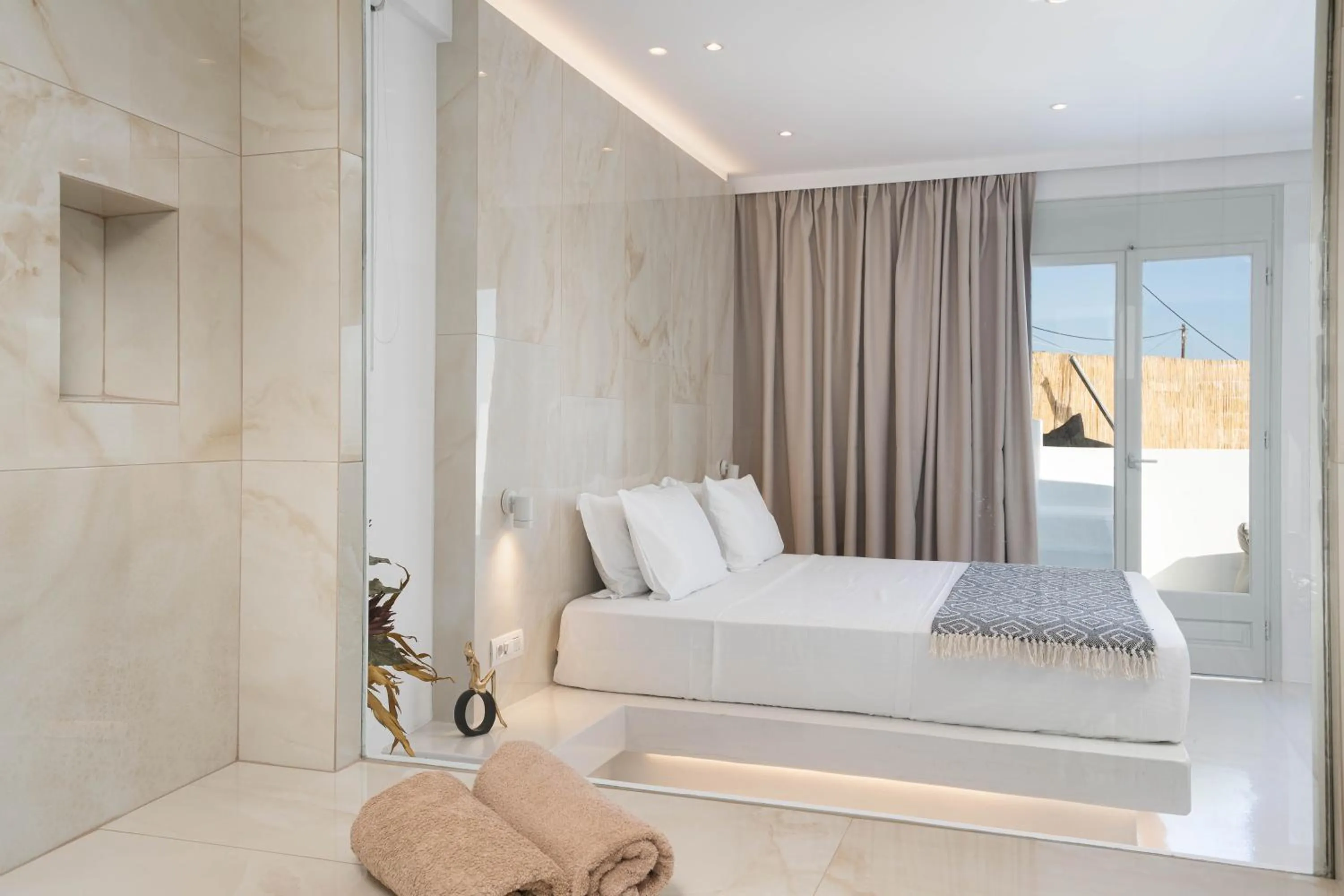 Bed in Cycladic Suites & Spa