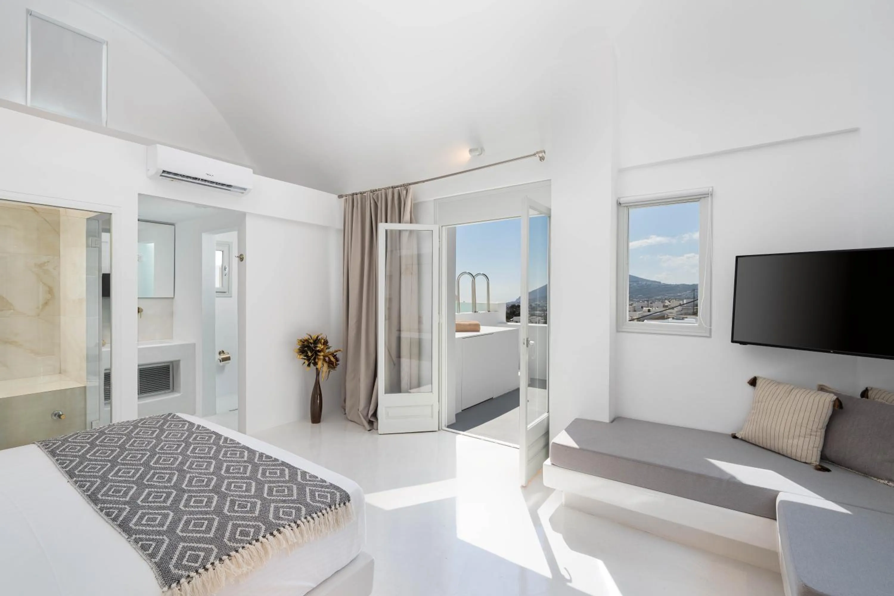 Bed in Cycladic Suites & Spa
