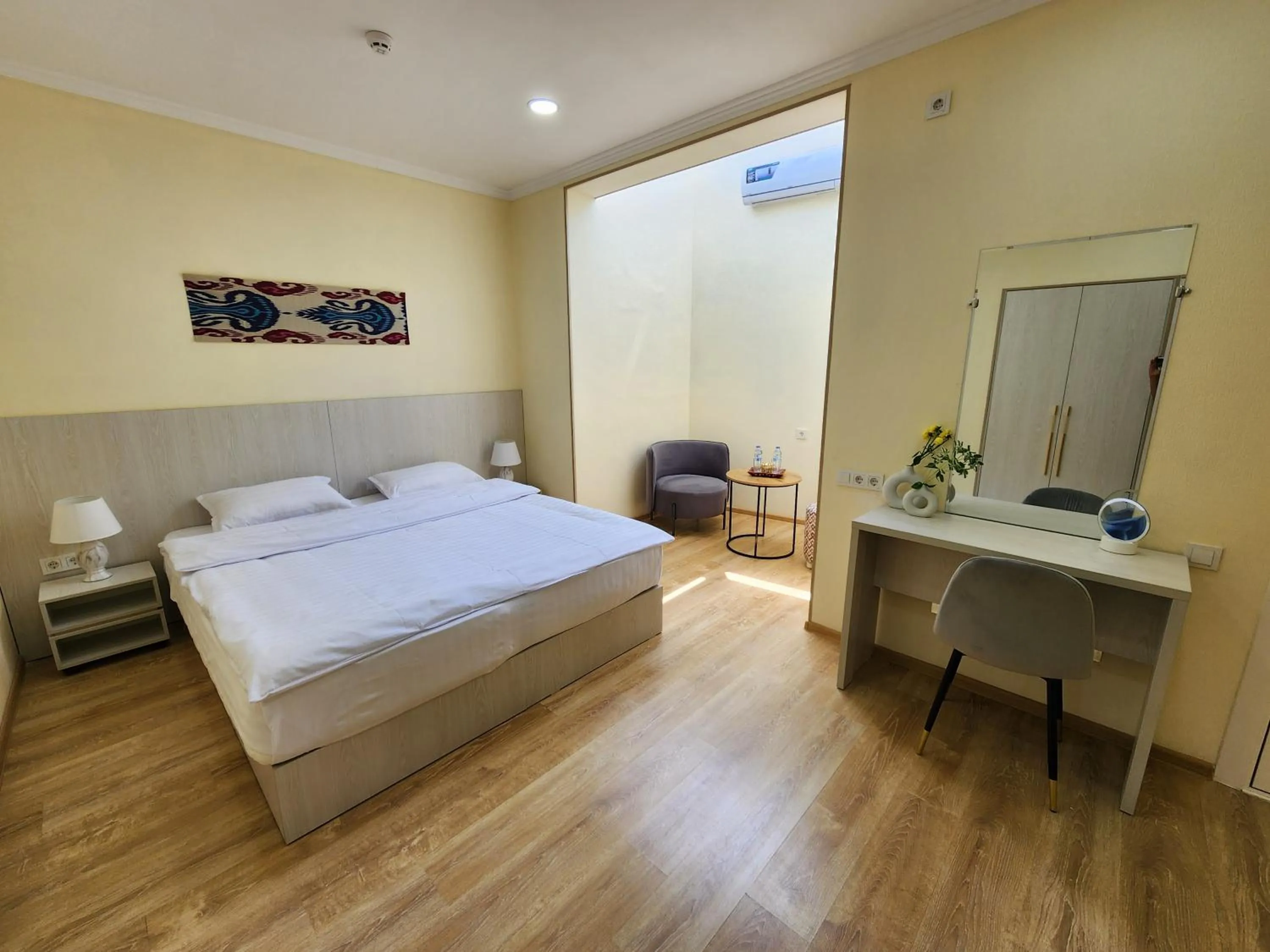 Photo of the whole room, Bed in Oasis Boutique