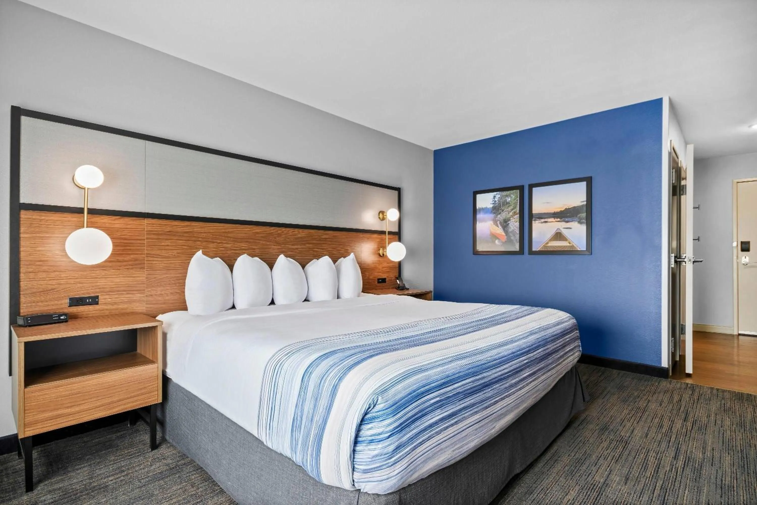 Bed in AmericInn by Wyndham International Falls