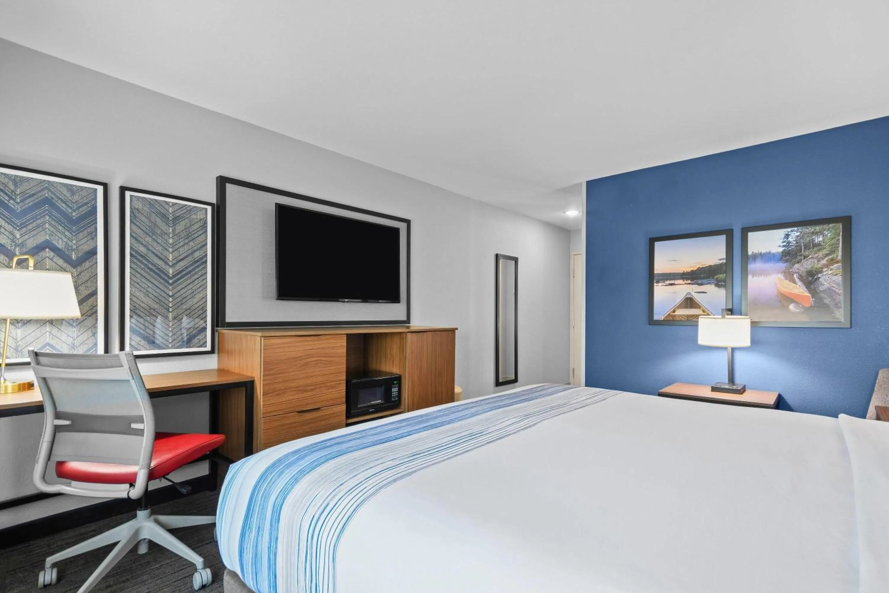 Bed in AmericInn by Wyndham International Falls