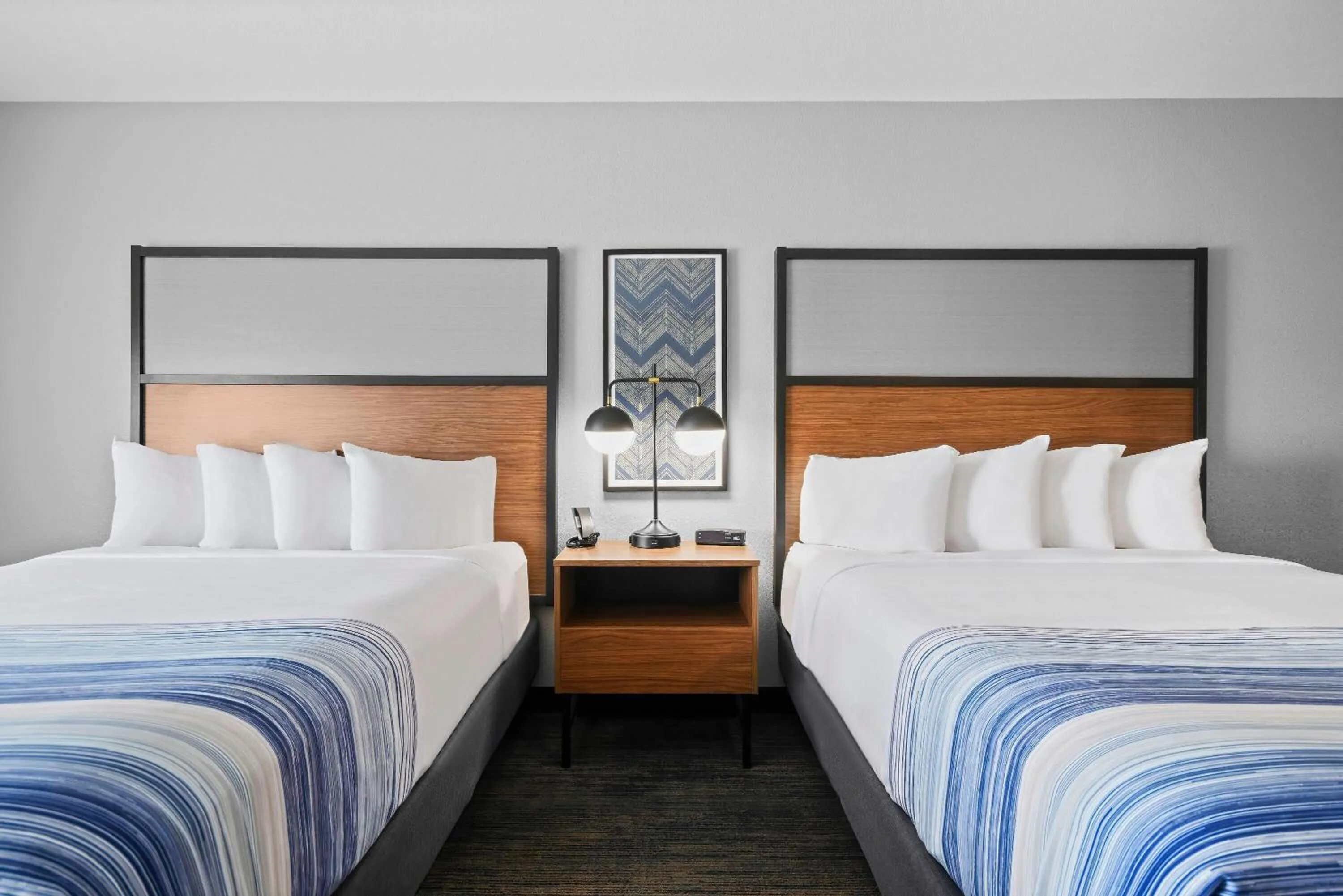 Bed in AmericInn by Wyndham International Falls