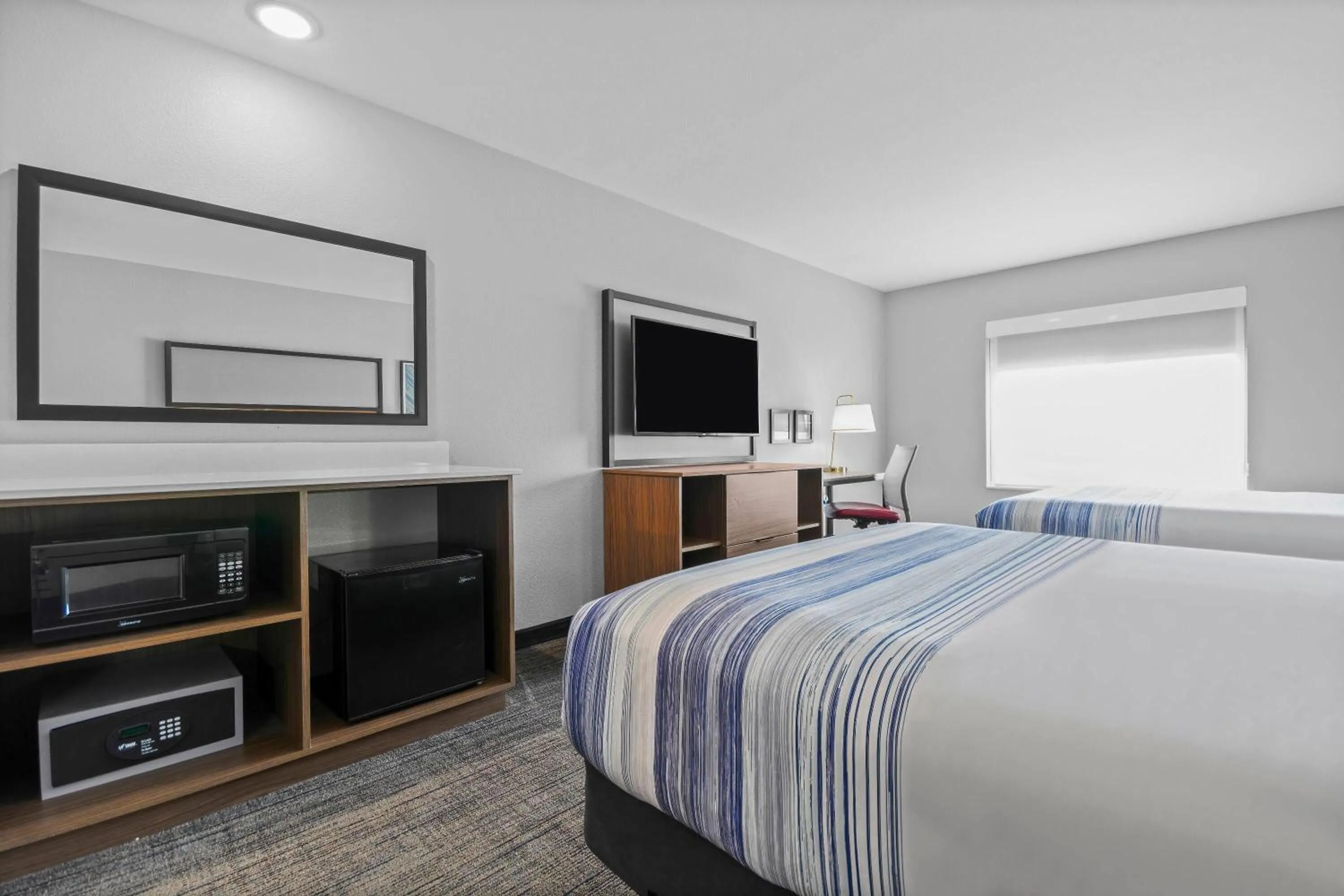 Bed in AmericInn by Wyndham International Falls