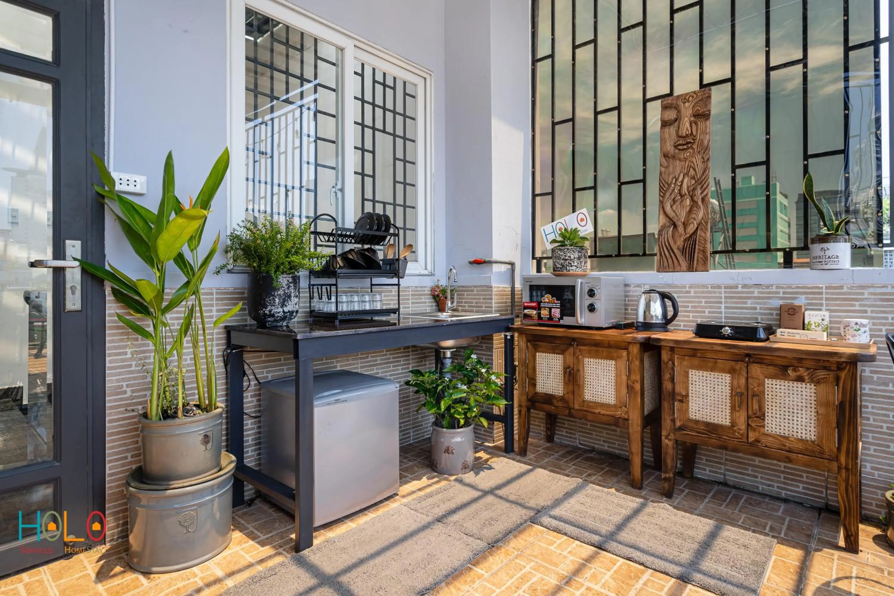 Communal kitchen in HoLo Central Saigon - Serviced HomeStay