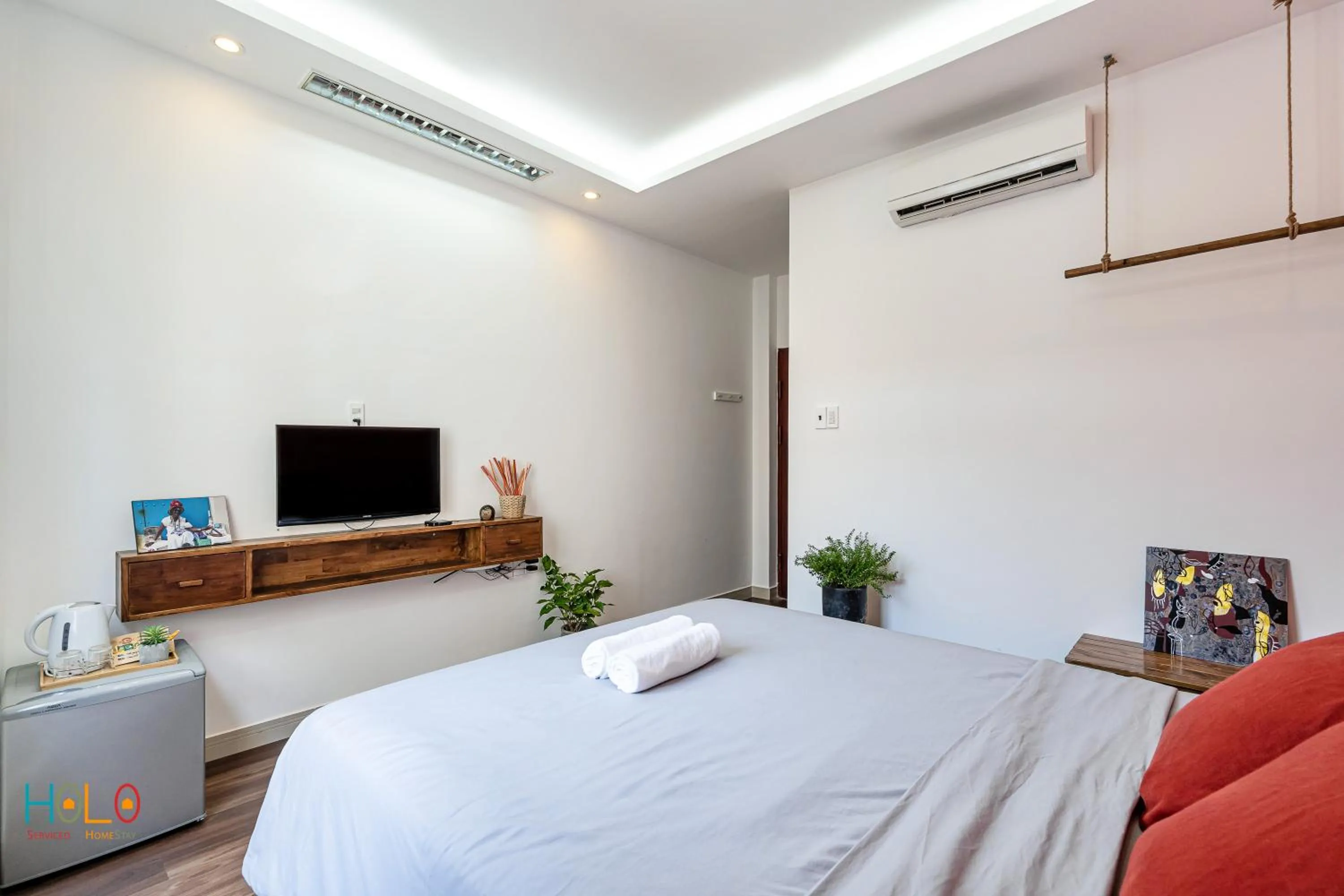 TV and multimedia, Bed in HoLo Central Saigon - Serviced HomeStay