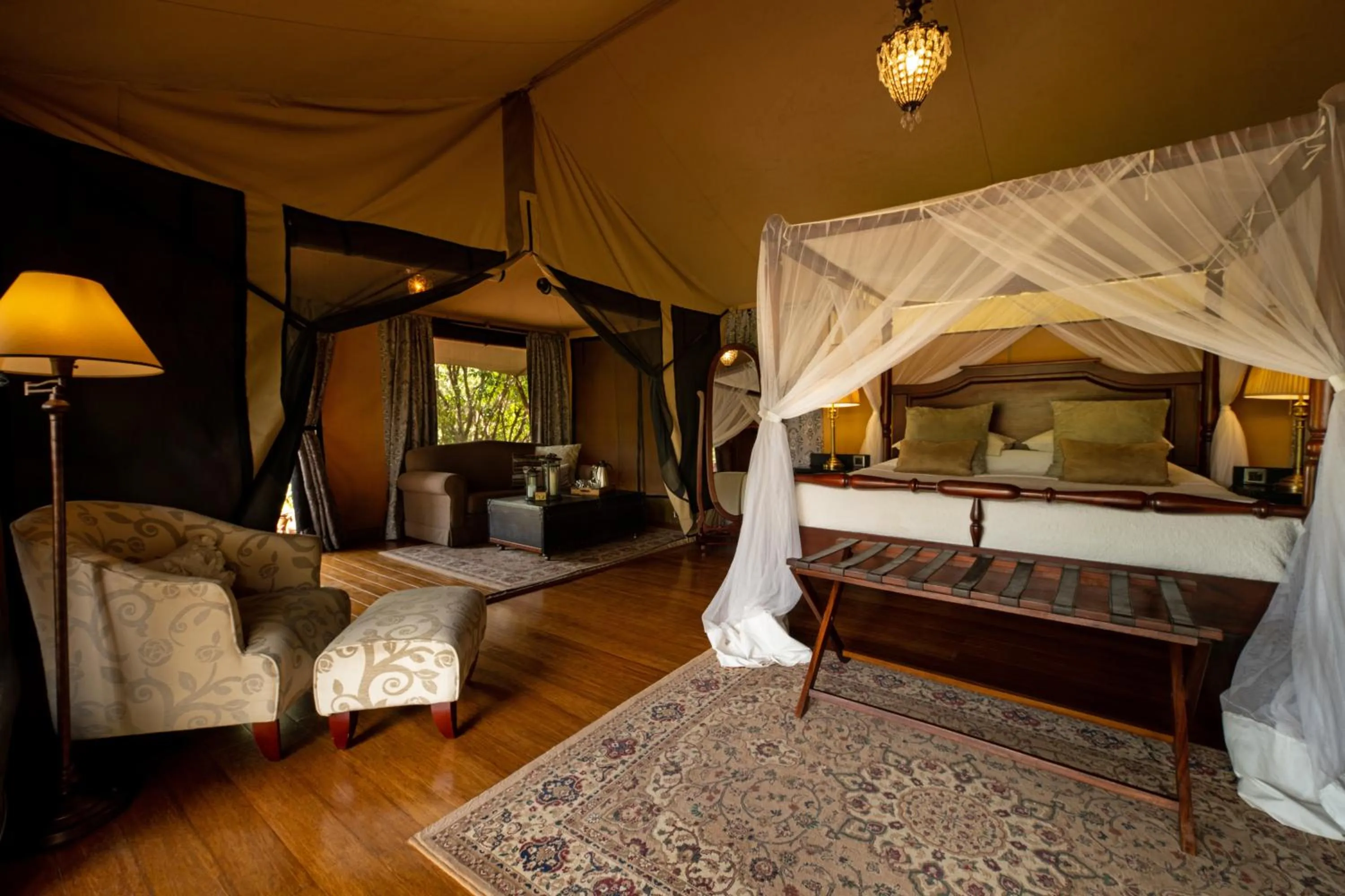Photo of the whole room, Bed in Elewana Sand River Mara