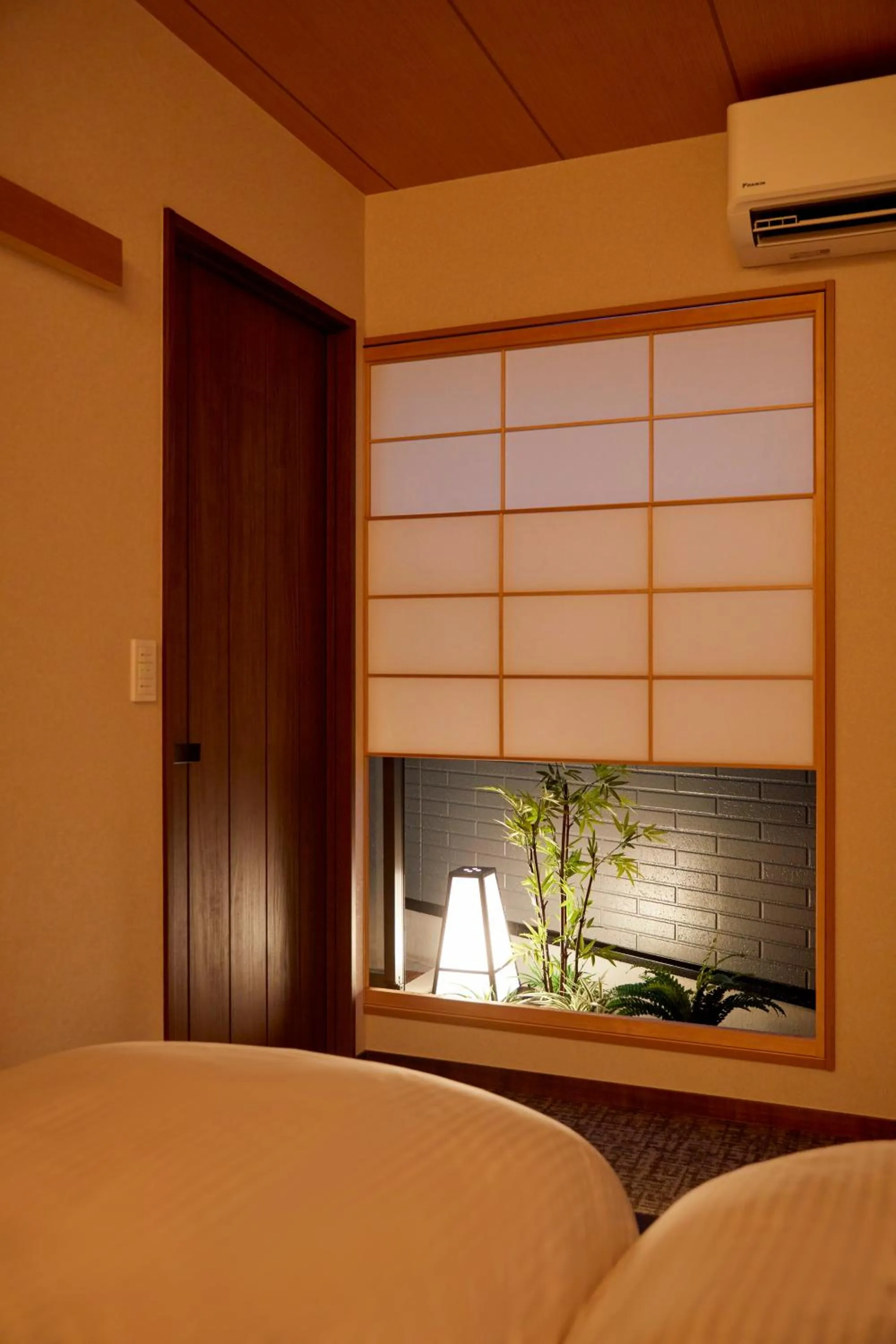 Bedroom, Bed in 古今 天下茶屋 with a private parking lot and a half open-air bath and direct to KIX