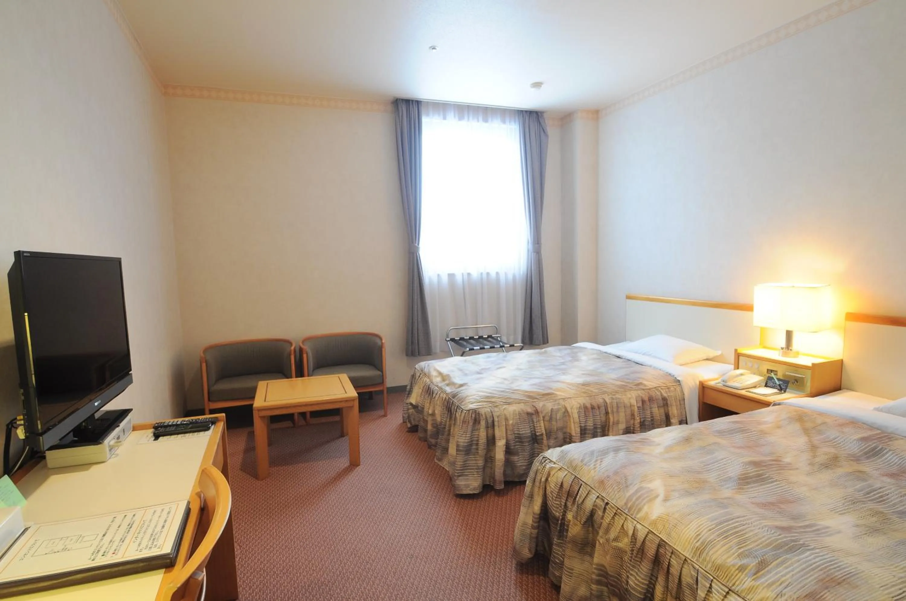 Photo of the whole room, Bed in Hotel Sapporo Sun Plaza