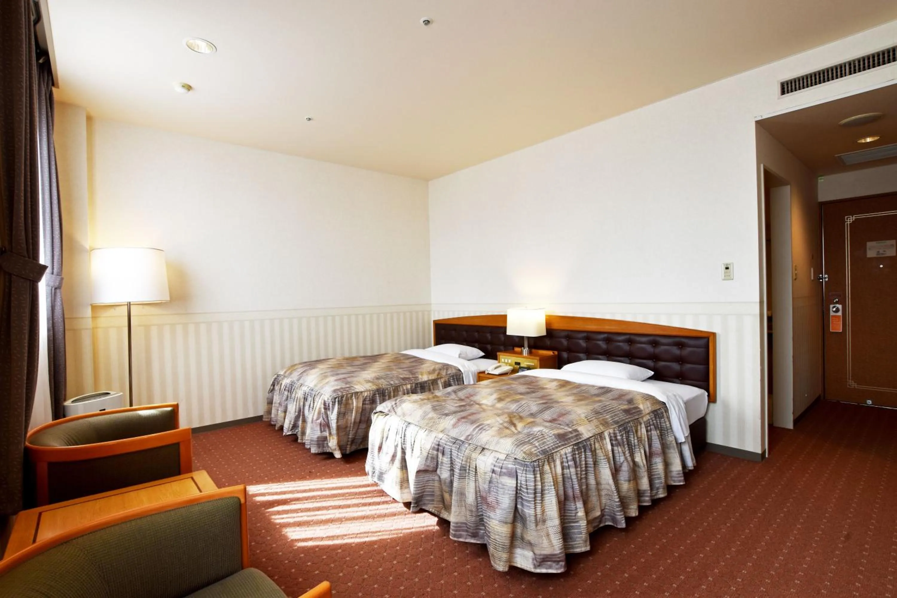 Photo of the whole room, Bed in Hotel Sapporo Sun Plaza