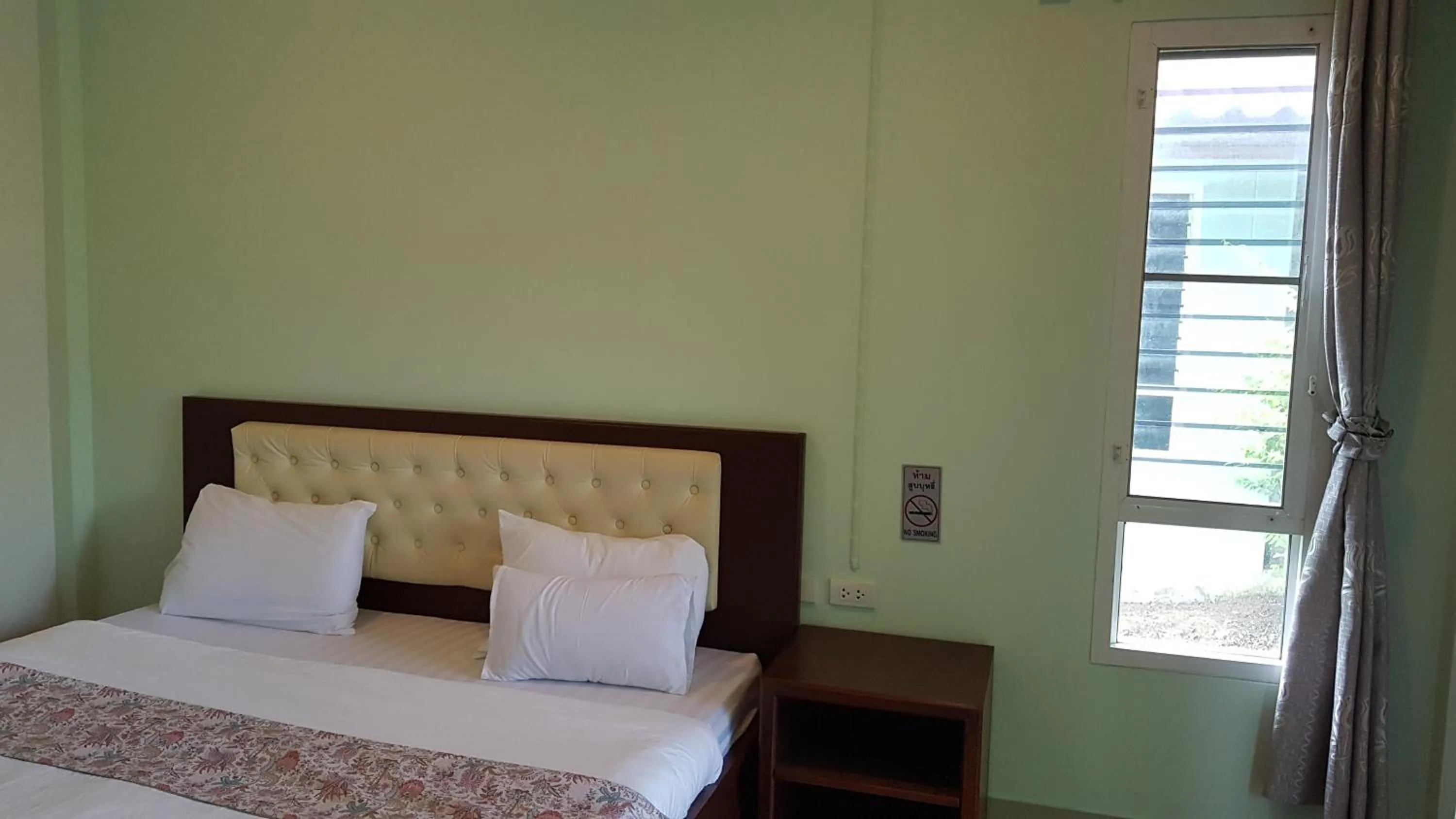 Bed in ที รีสอร์ท T Resort Suphanburi