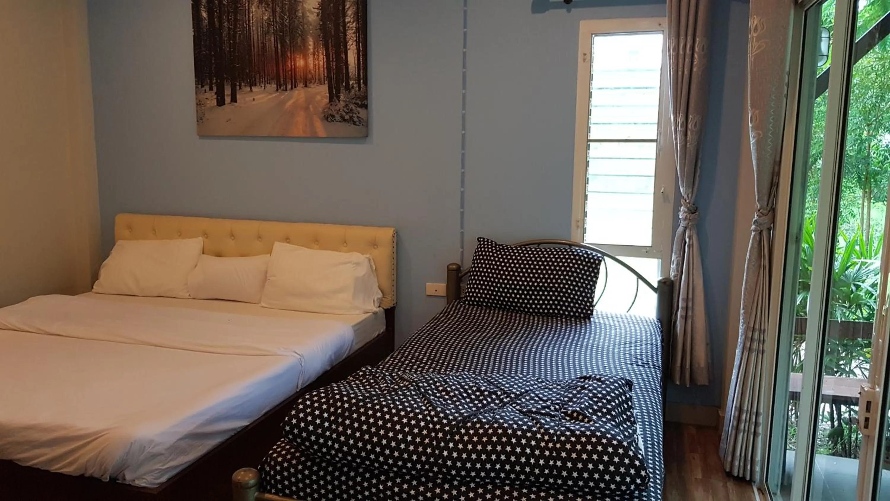 Bed in ที รีสอร์ท T Resort Suphanburi