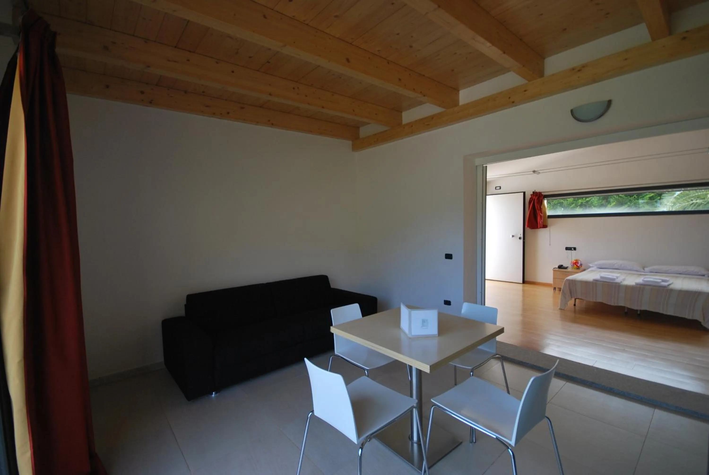 Seating area, Bed in Natur Hotel Tanca