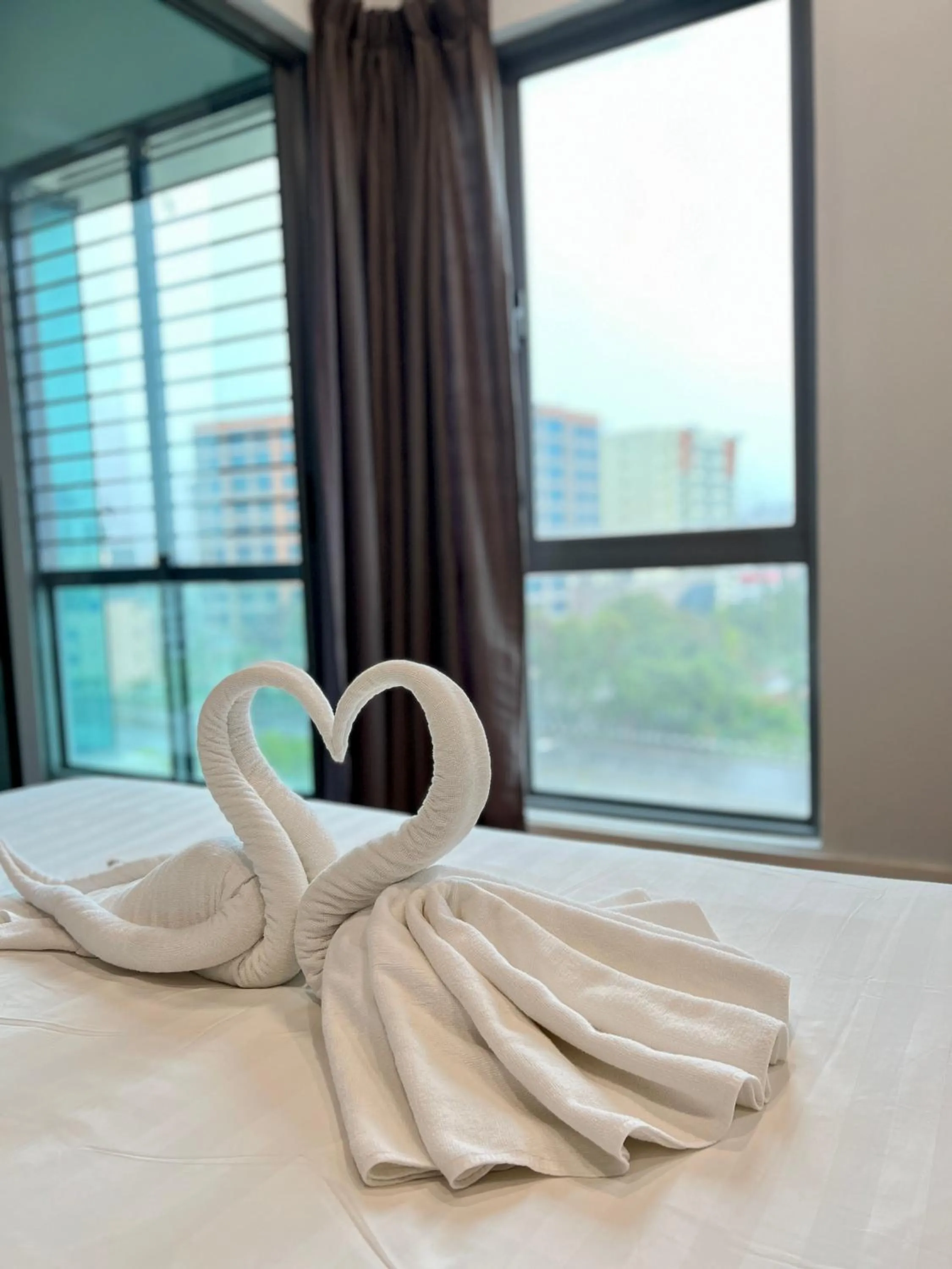 Decorative detail, Bed in AJ Suites @ Loft Imago KK