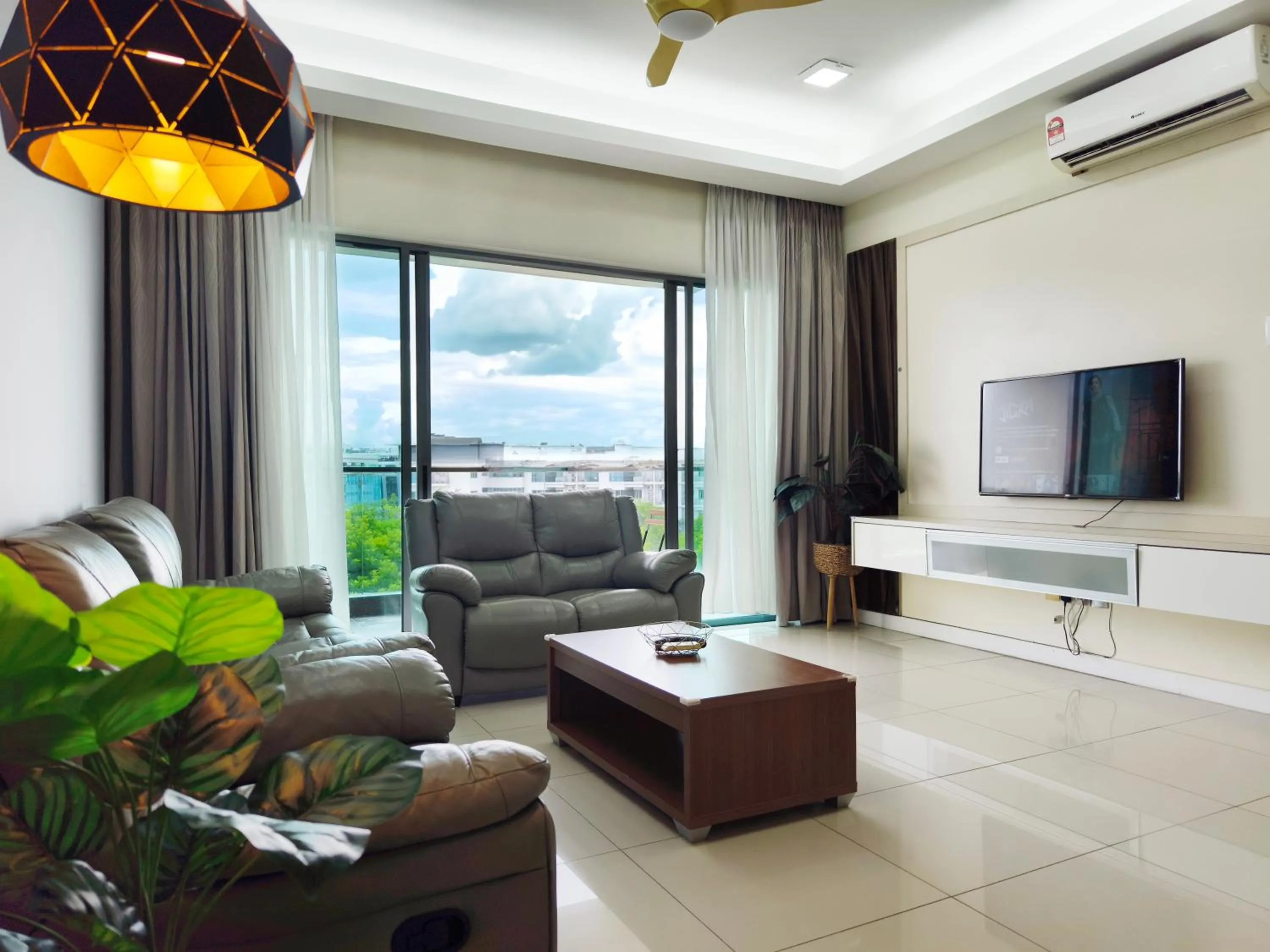 Communal lounge/ TV room in AJ Suites @ Loft Imago KK