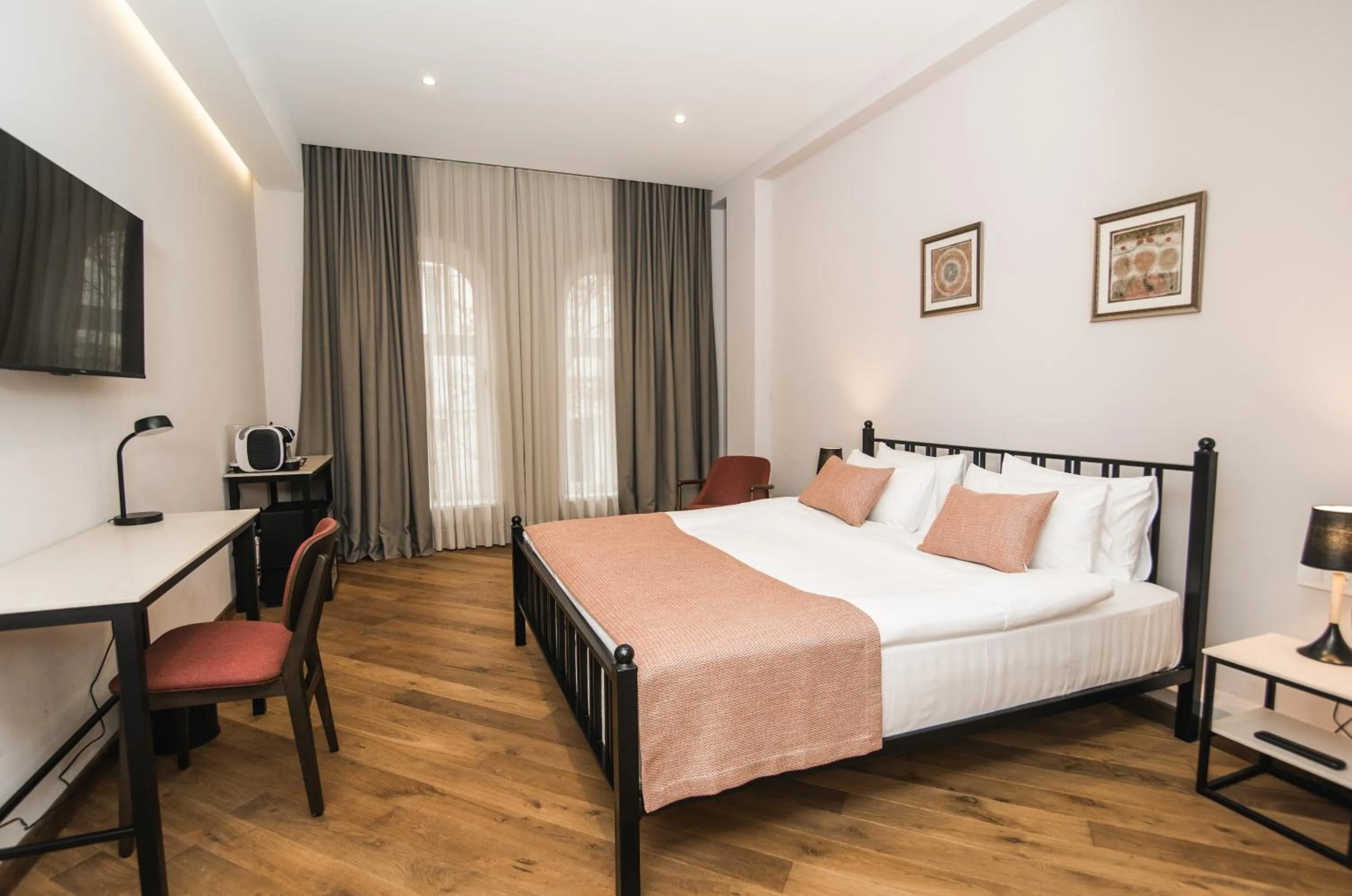 Photo of the whole room, Bed in Makmani Boutique Hotel by DNT Group