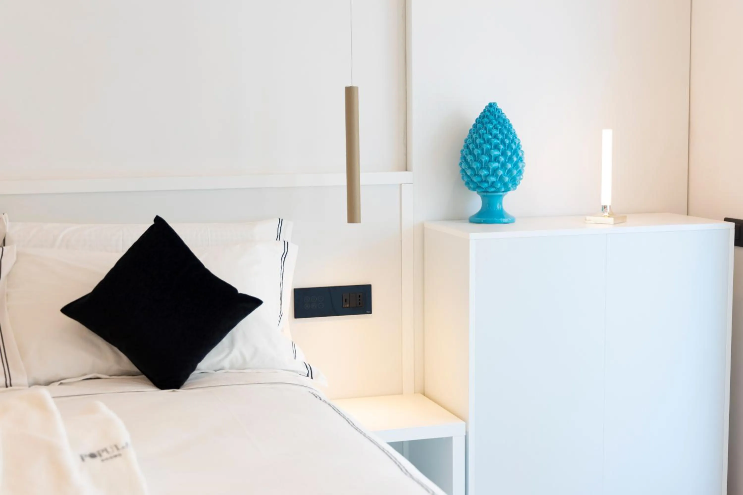 Bed in Popula Rooms & Mediterranean Bay