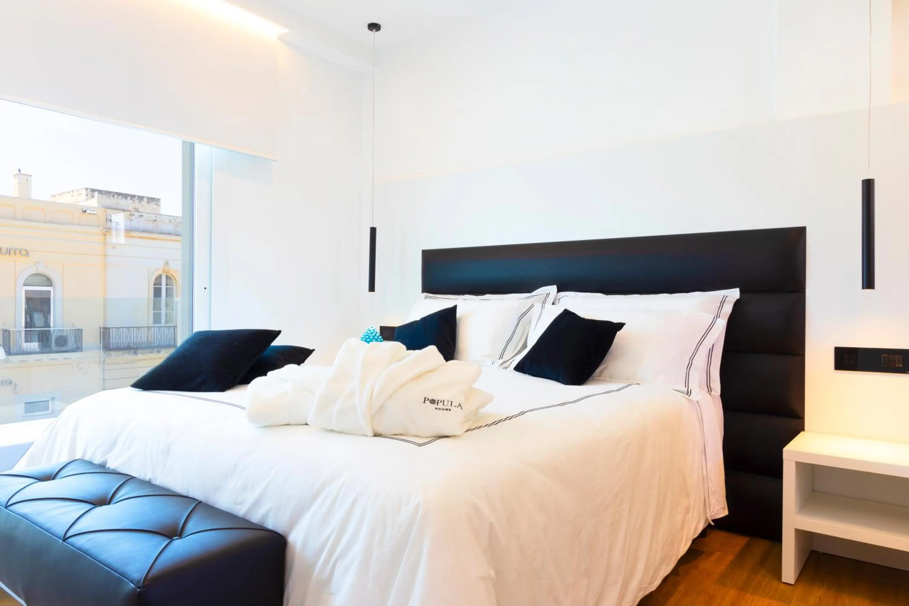 Bed in Popula Rooms & Mediterranean Bay