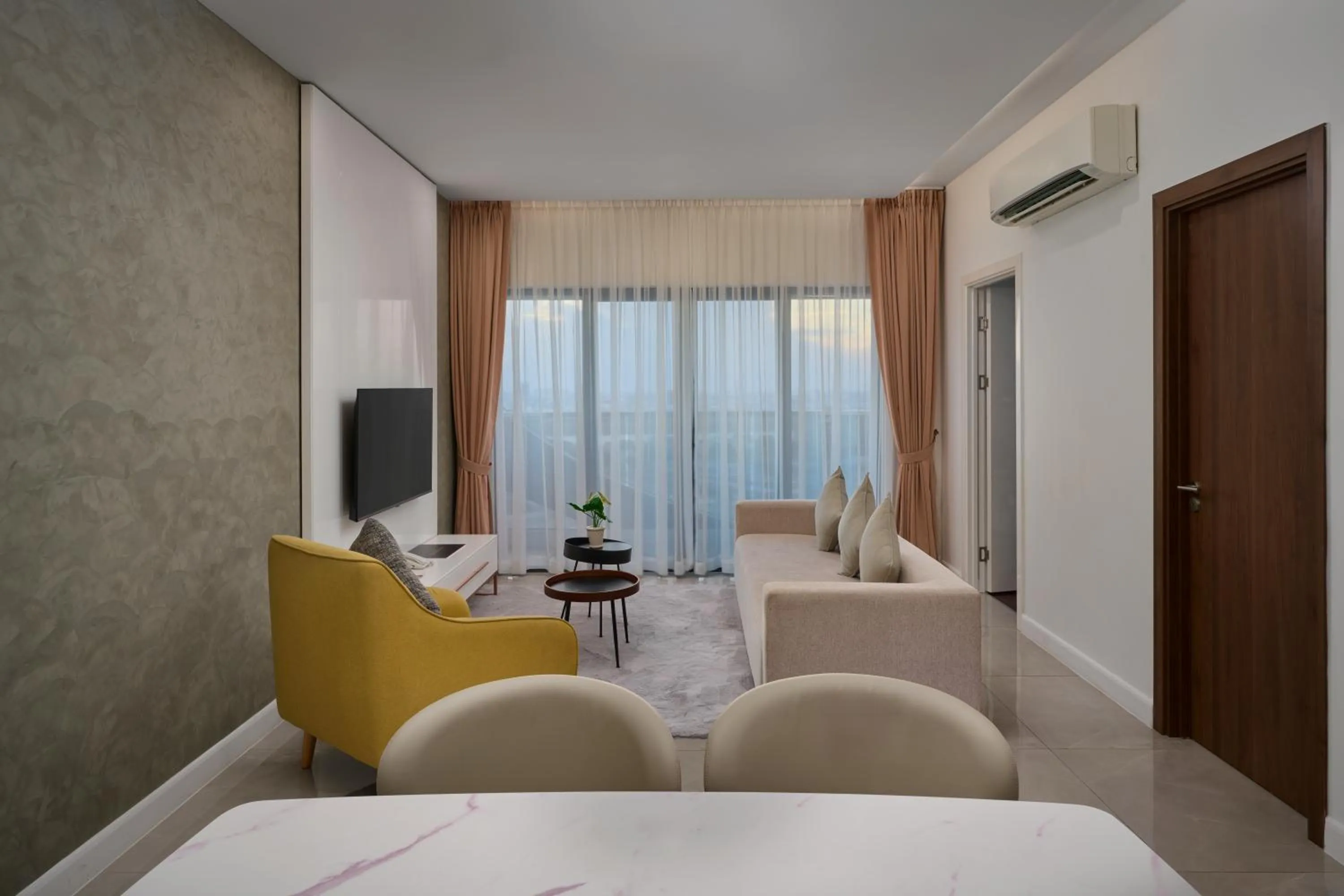 Living room, Bed in The Peninsula Phnom Penh