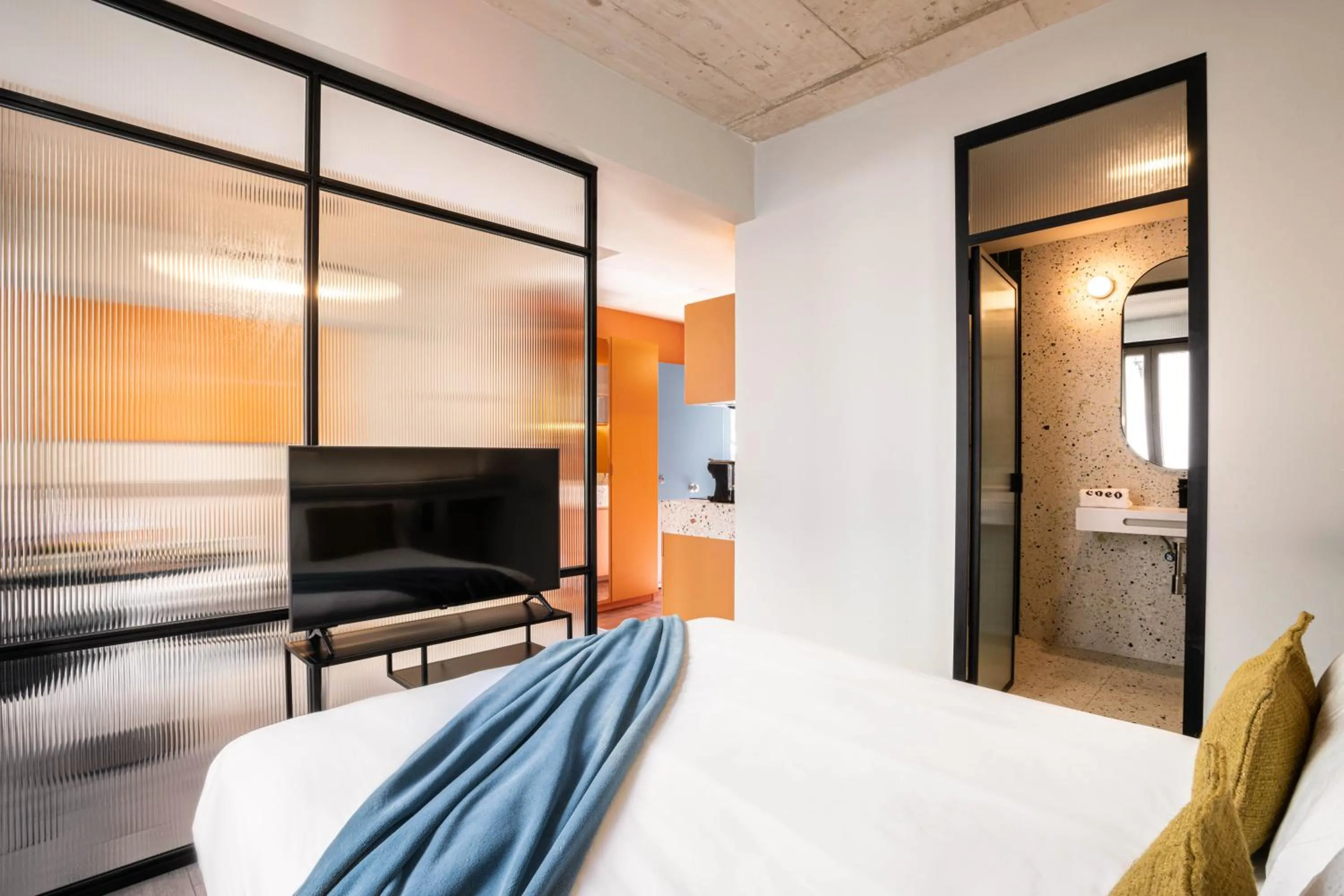 Bed in Coeo Parras Design Apartments