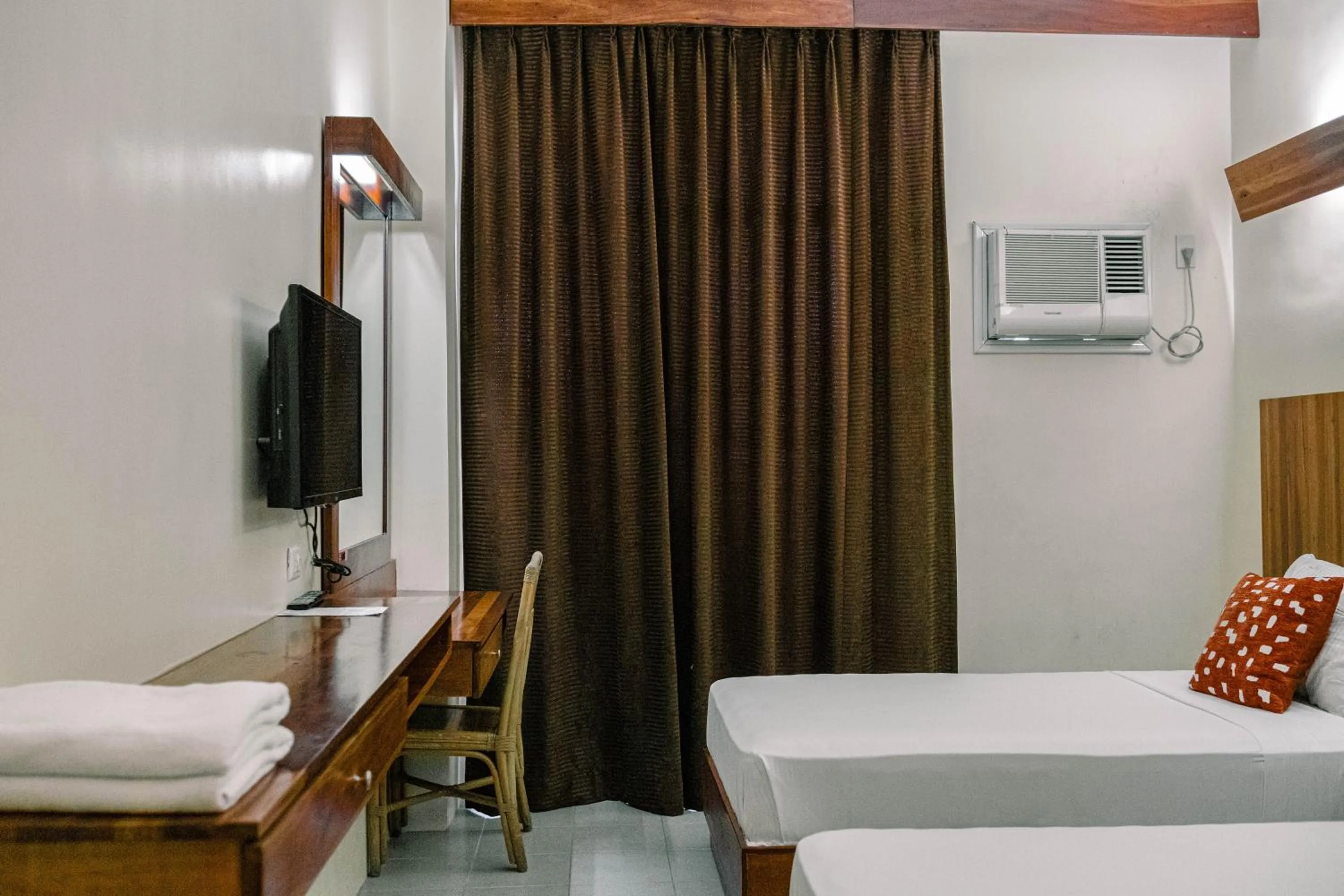 Bed in Tsai Hotel and Residences