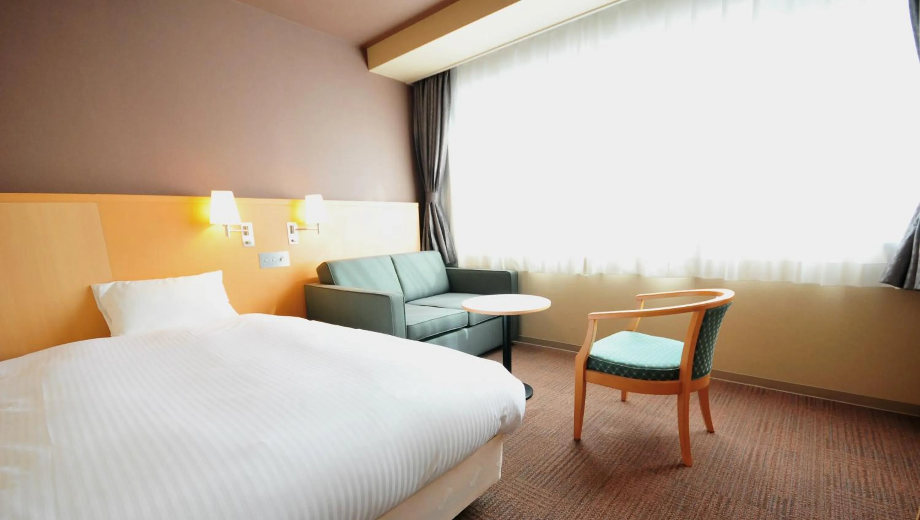 Seating area, Bed in Hotel Premium Green Hills