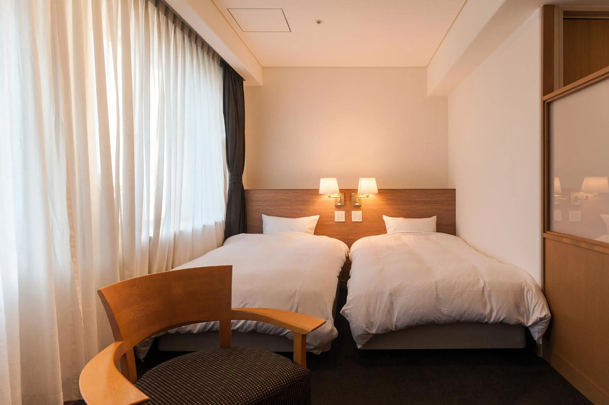 Bed in Mito Sannomaru Hotel