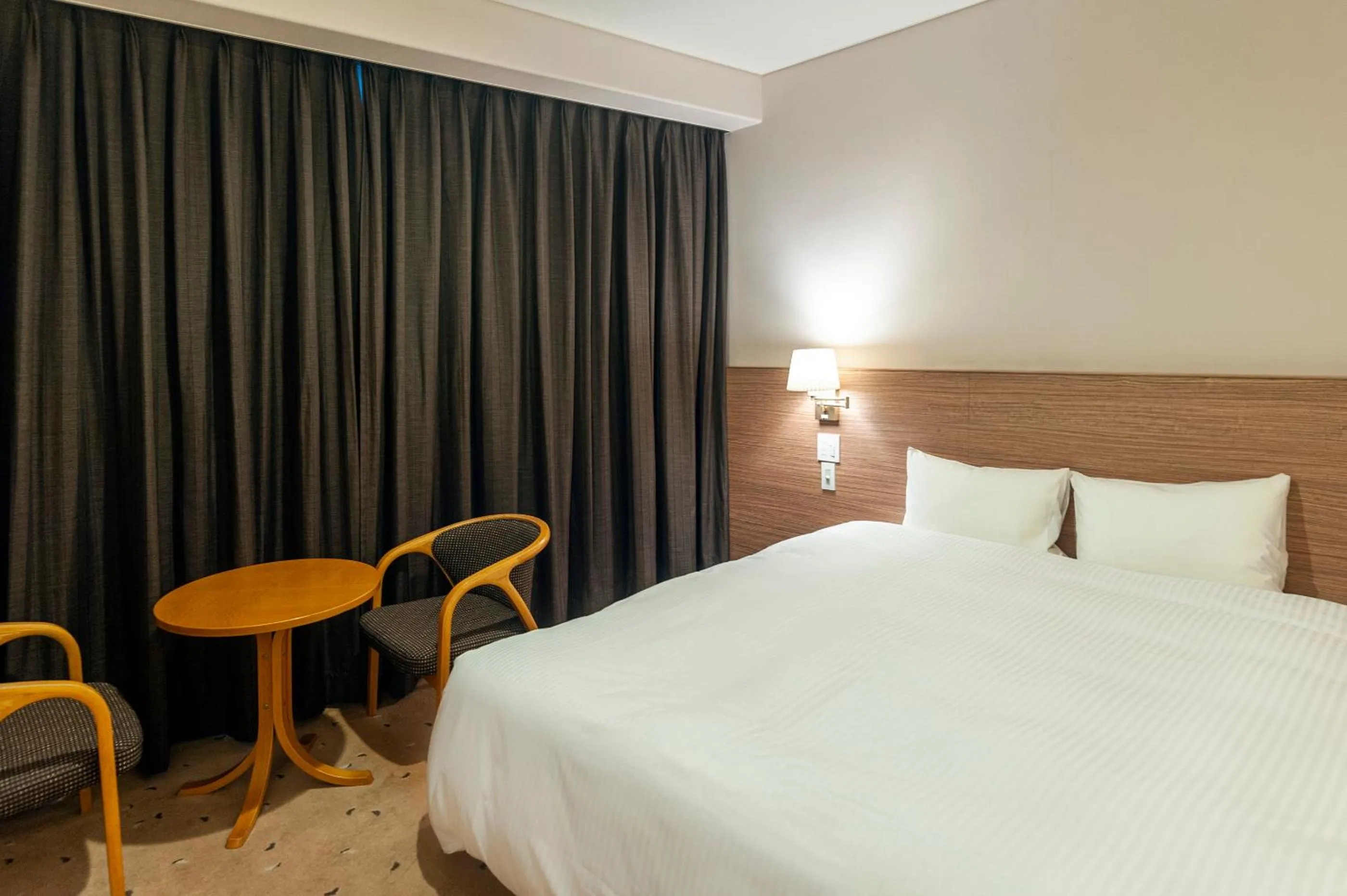 Bed in Mito Sannomaru Hotel