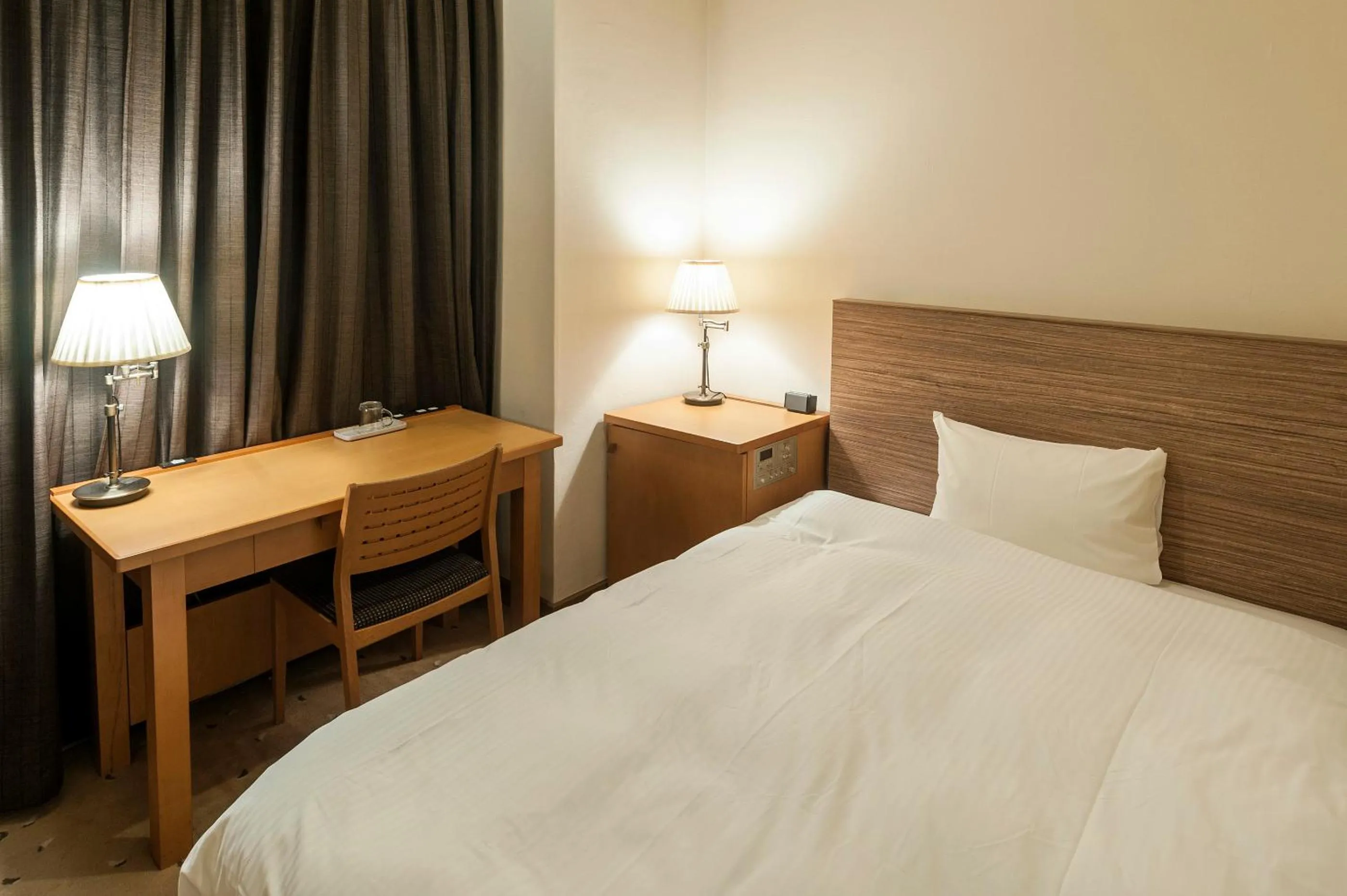 Bed in Mito Sannomaru Hotel