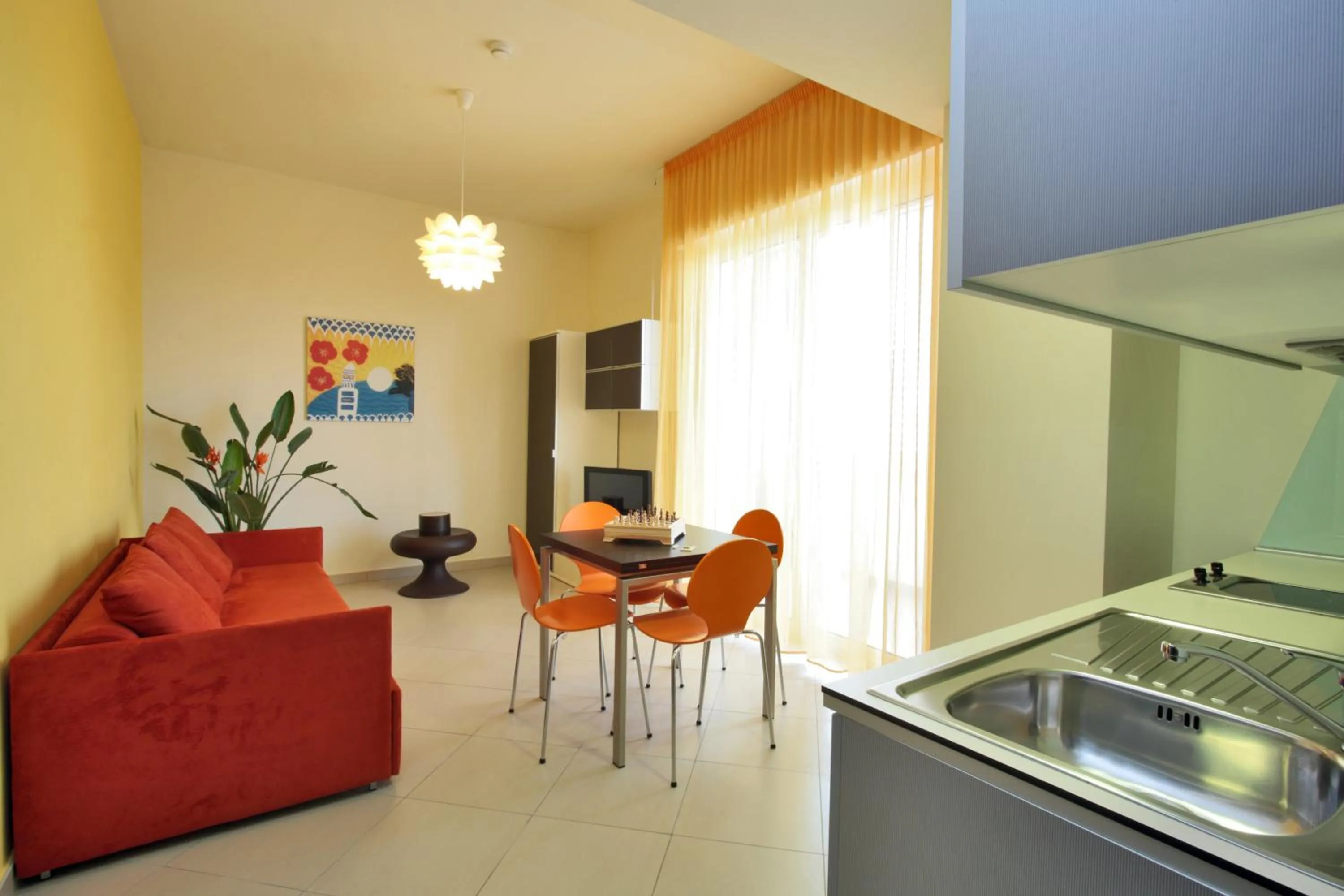 Kitchen or kitchenette in Noha Suite Hotel