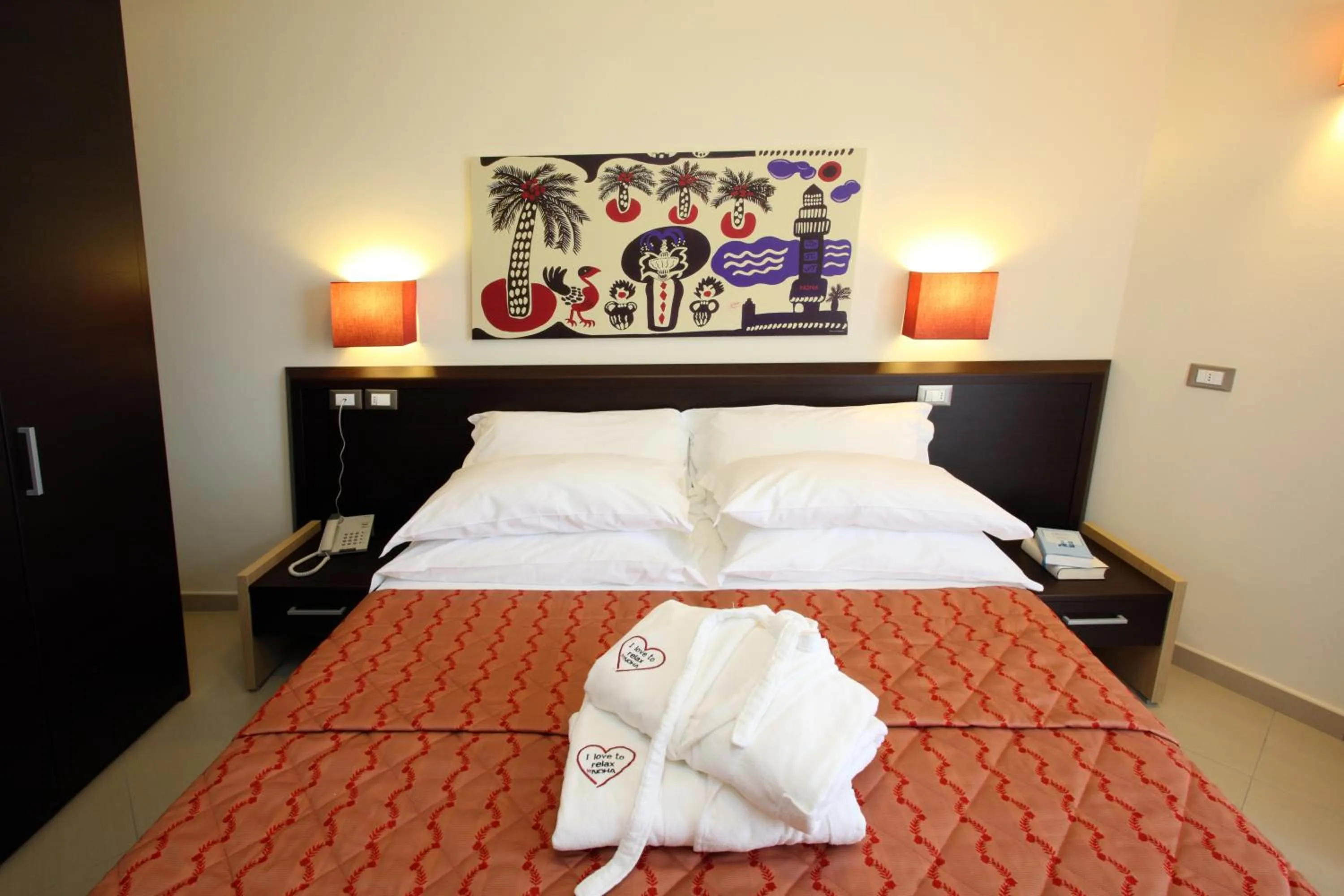 Bed in Noha Suite Hotel