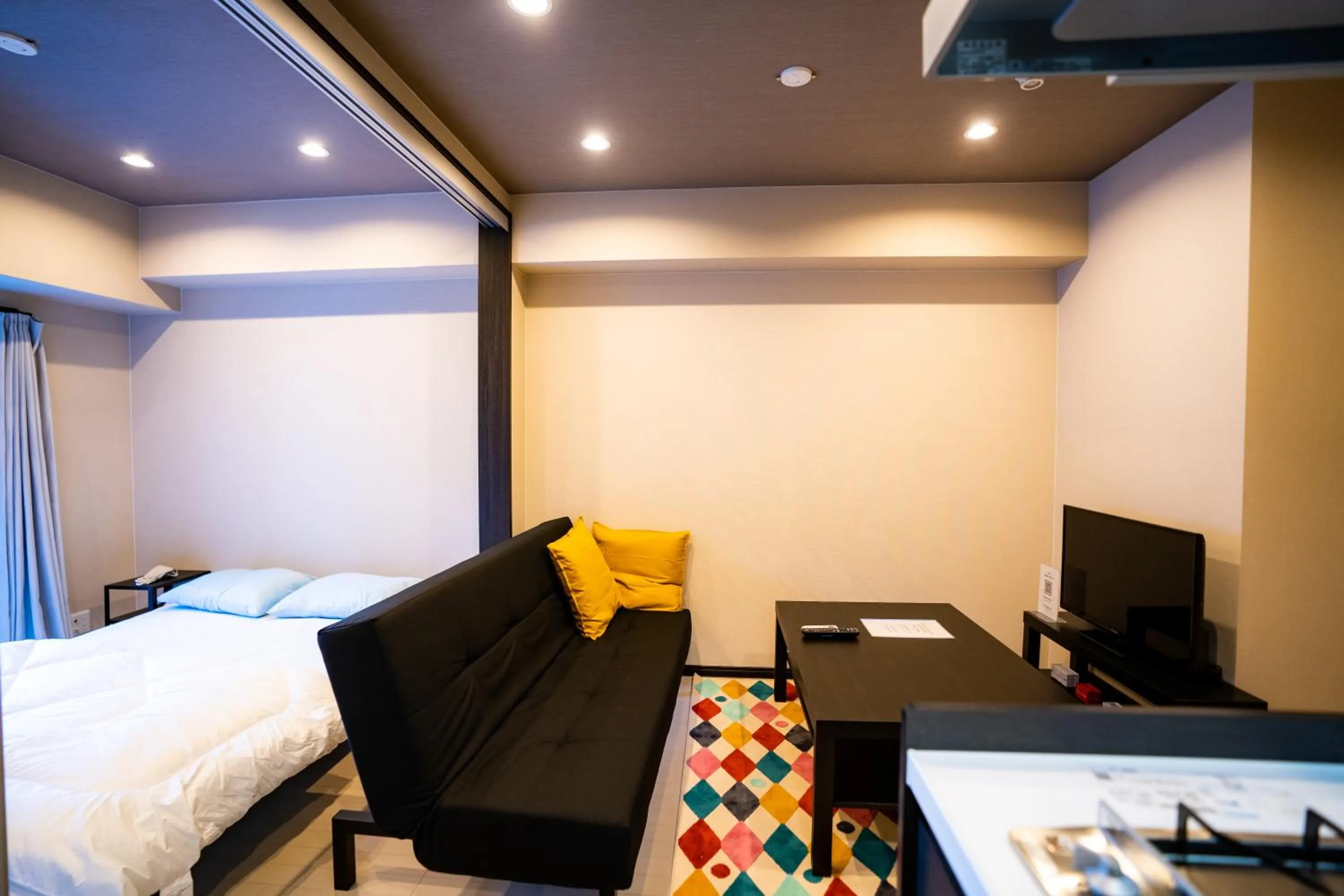 Living room, Bed in Sakimoto Residence Namba Minami