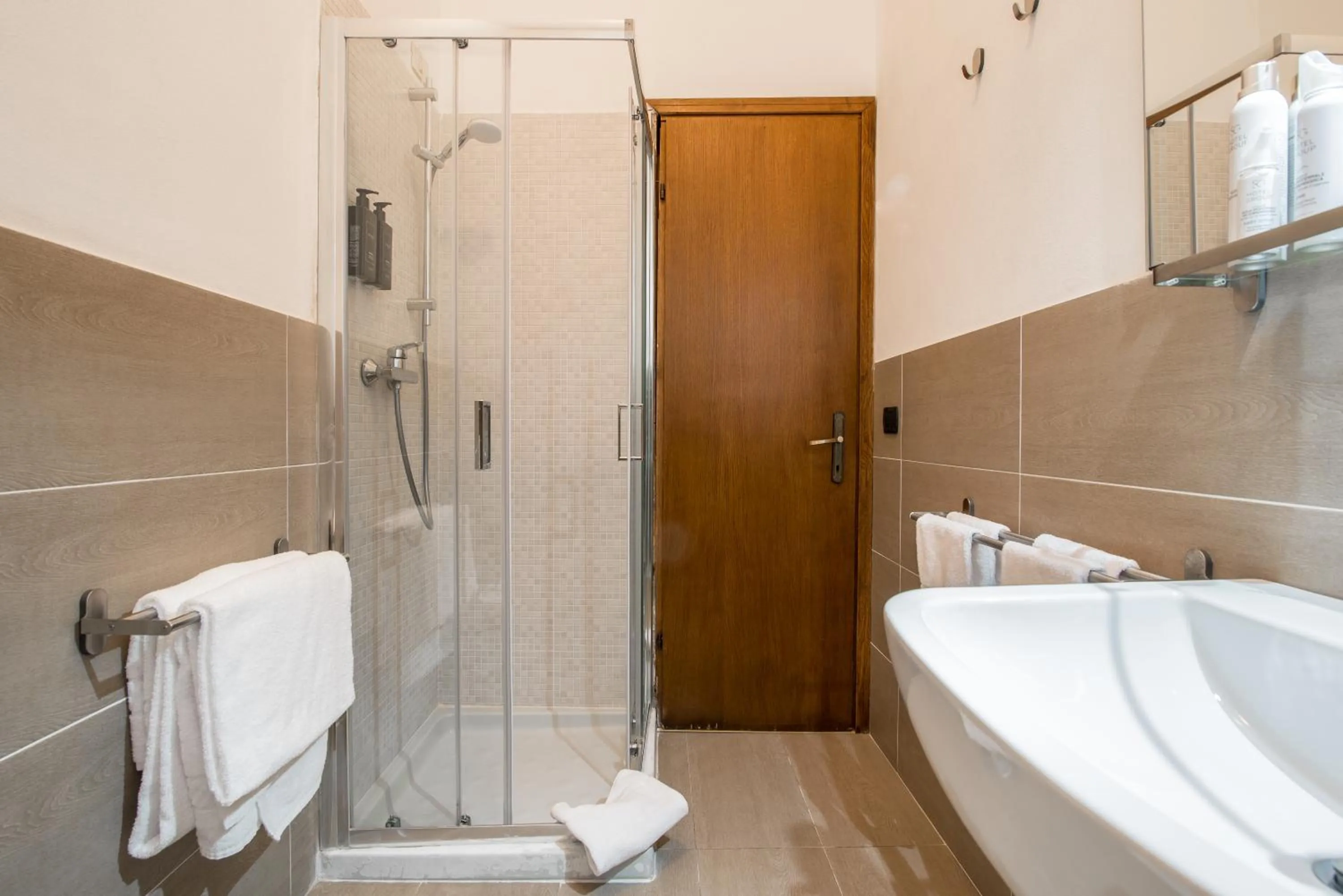 Bathroom in AHG Golf Hotel Porta Del Sole