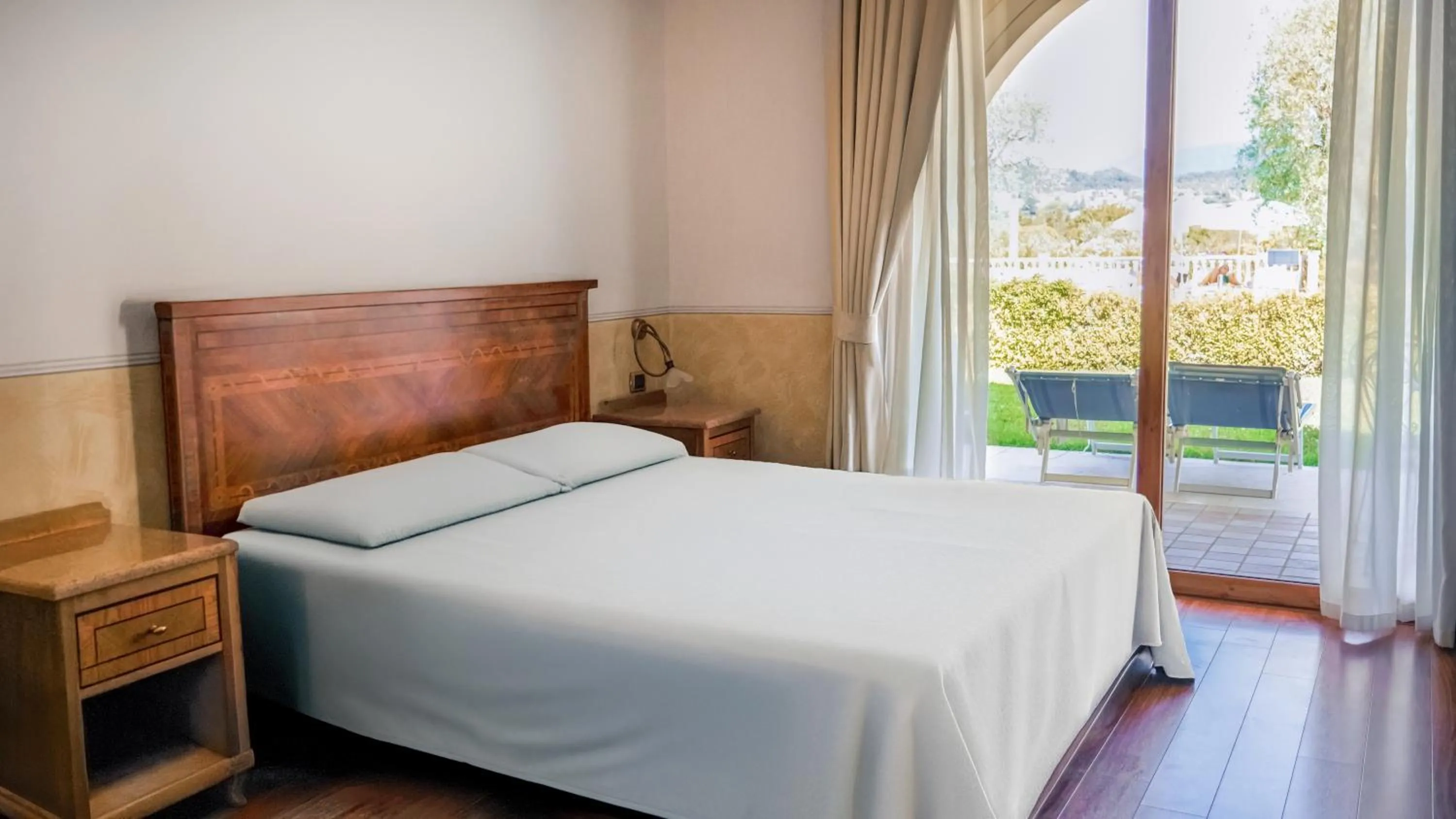 Bedroom, Bed in AHG Golf Hotel Porta Del Sole