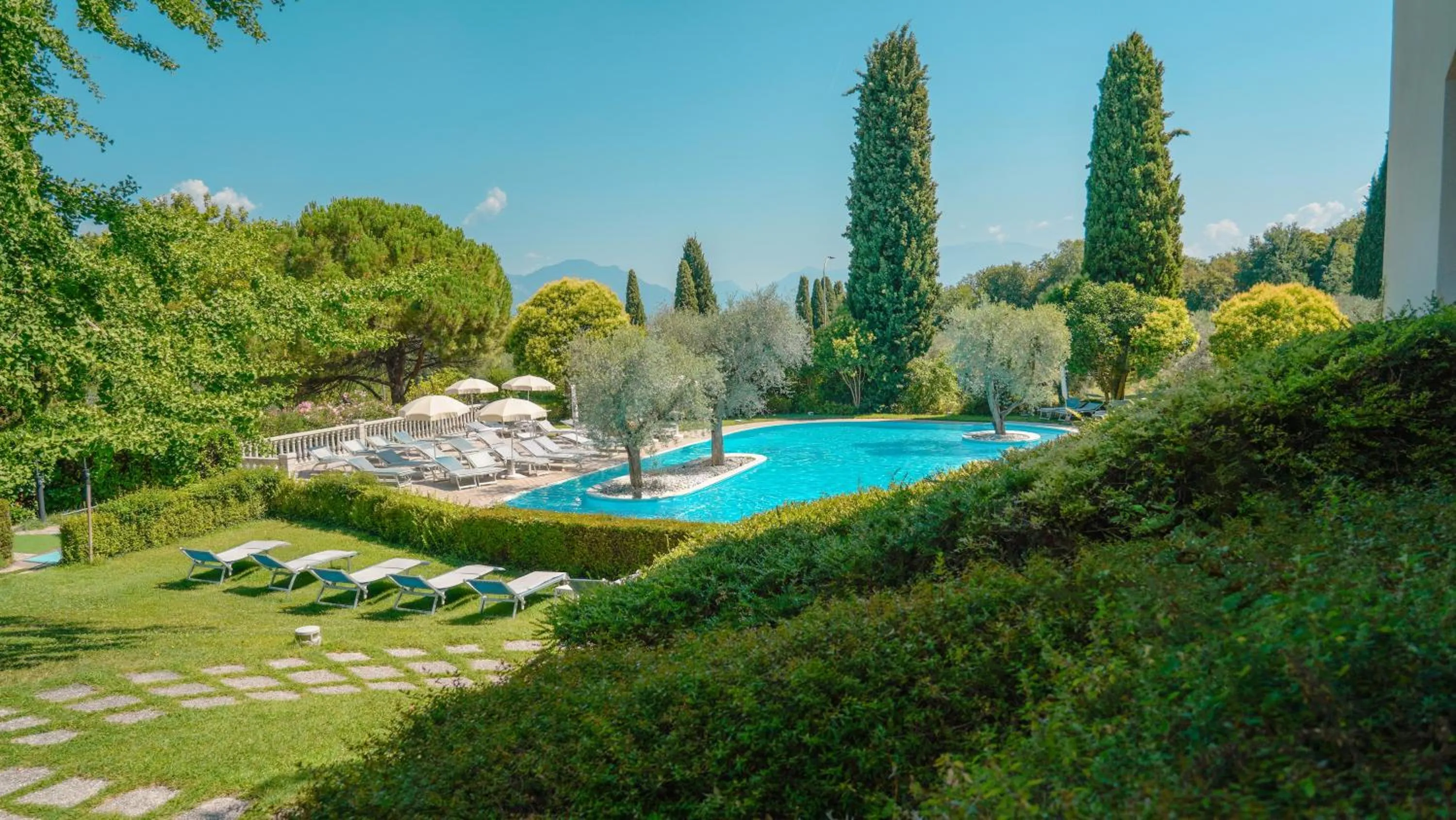 Garden view in AHG Golf Hotel Porta Del Sole