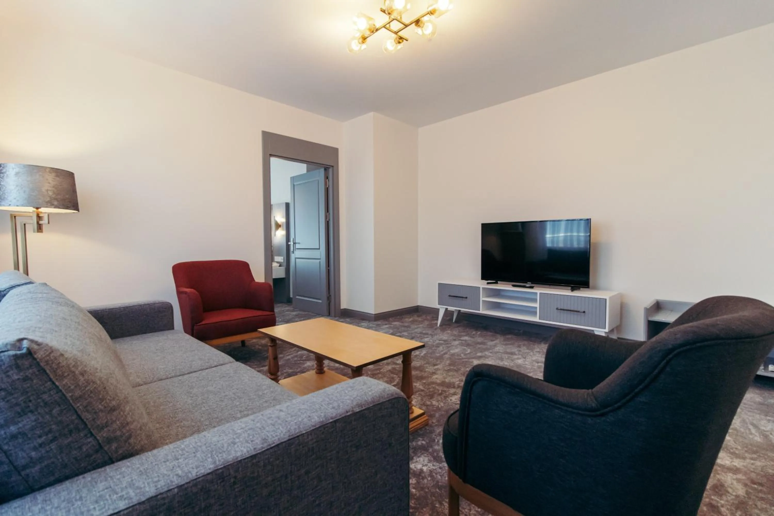 Communal lounge/ TV room in CK Farabi Hotel